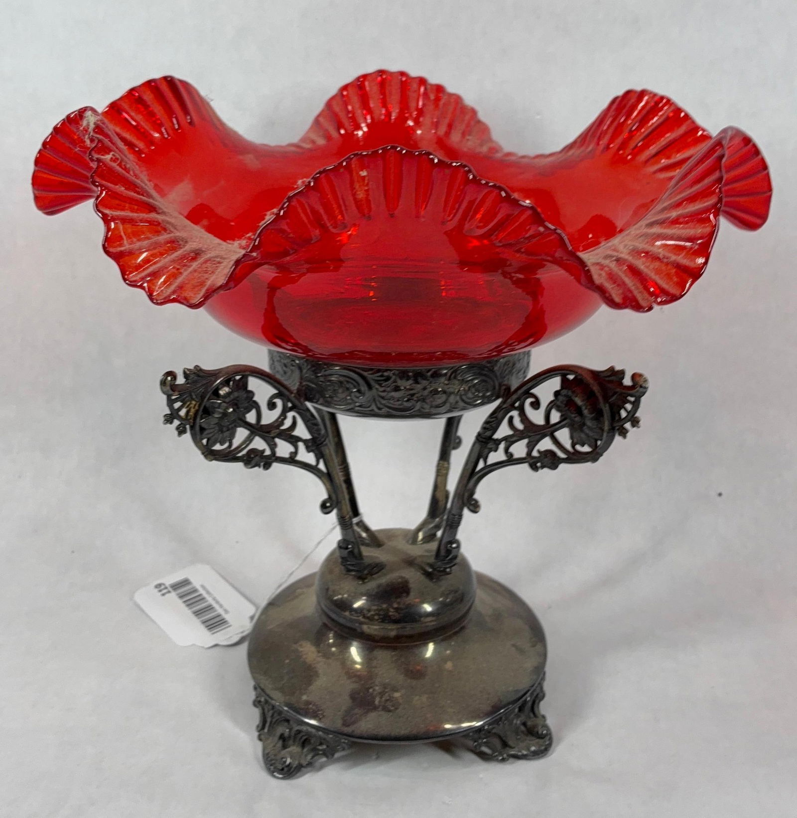 Ruby Red Ruffled Edge Compote on Silver Plated Stand: Quadruple plated E&G Webster base with decorated handles and scroll style feet. Numbered 163. This may not be an original pair but they look great together. Ruffled edge glass bowl is 11 inches in