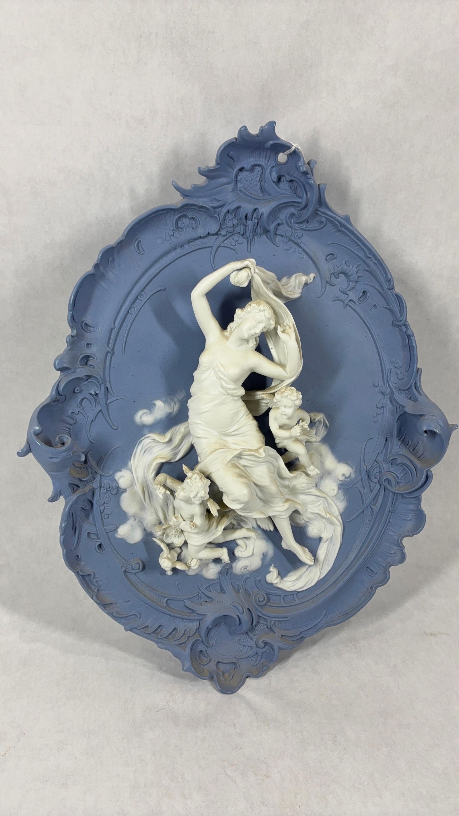 Volkstedt German Jasperware Bisque Plaque: An early Art Nouveau German Cherub sculpture. Excellent condition with no chips or cracks found. A satin blue background with creamy white 3D images. 14x11.