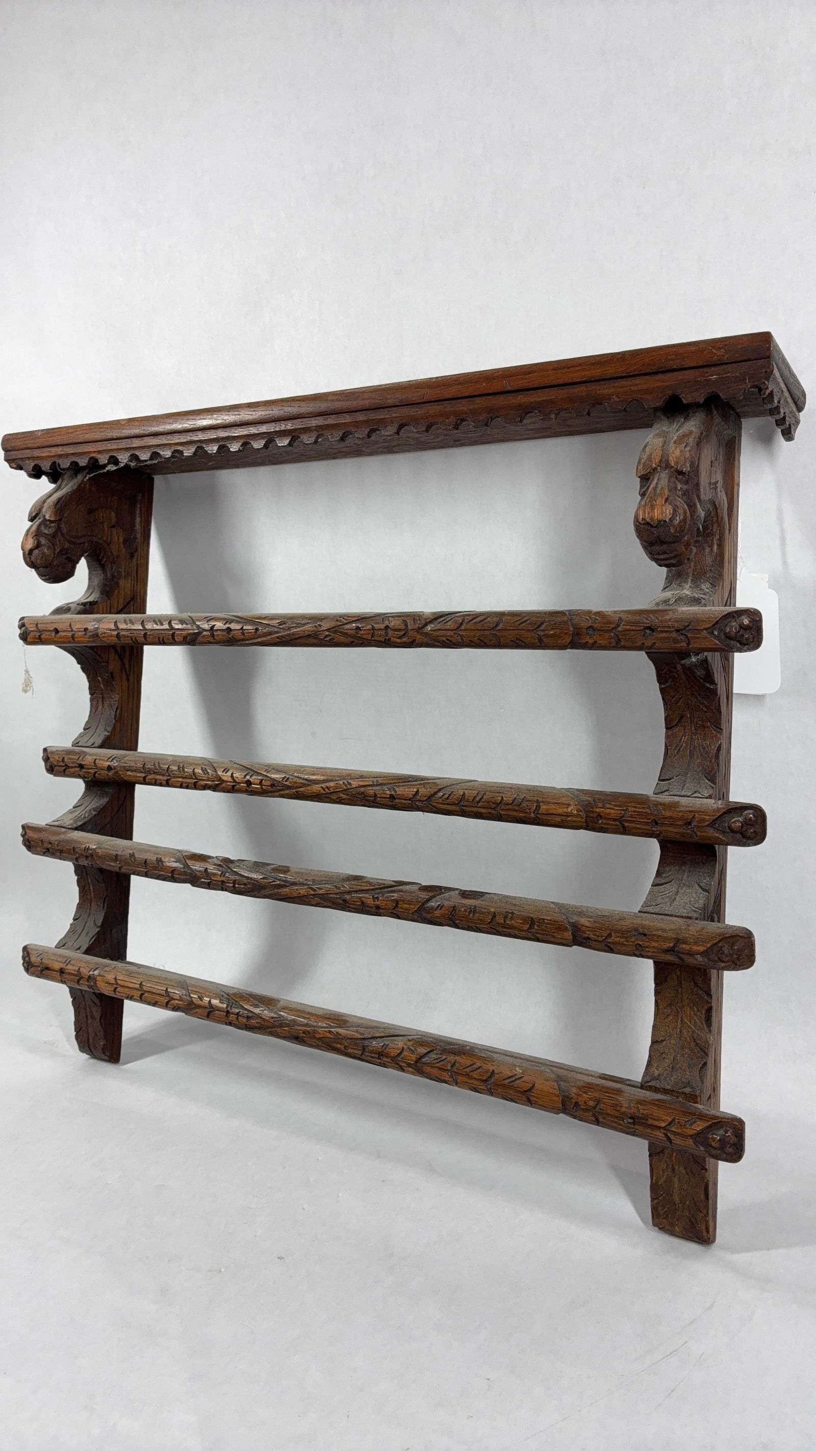 Carved Dragon Head Plate Rack: Likely walnut, with two shelves. A dragon face shows to both sides with detailed carvings throughout. 19x17x3.5