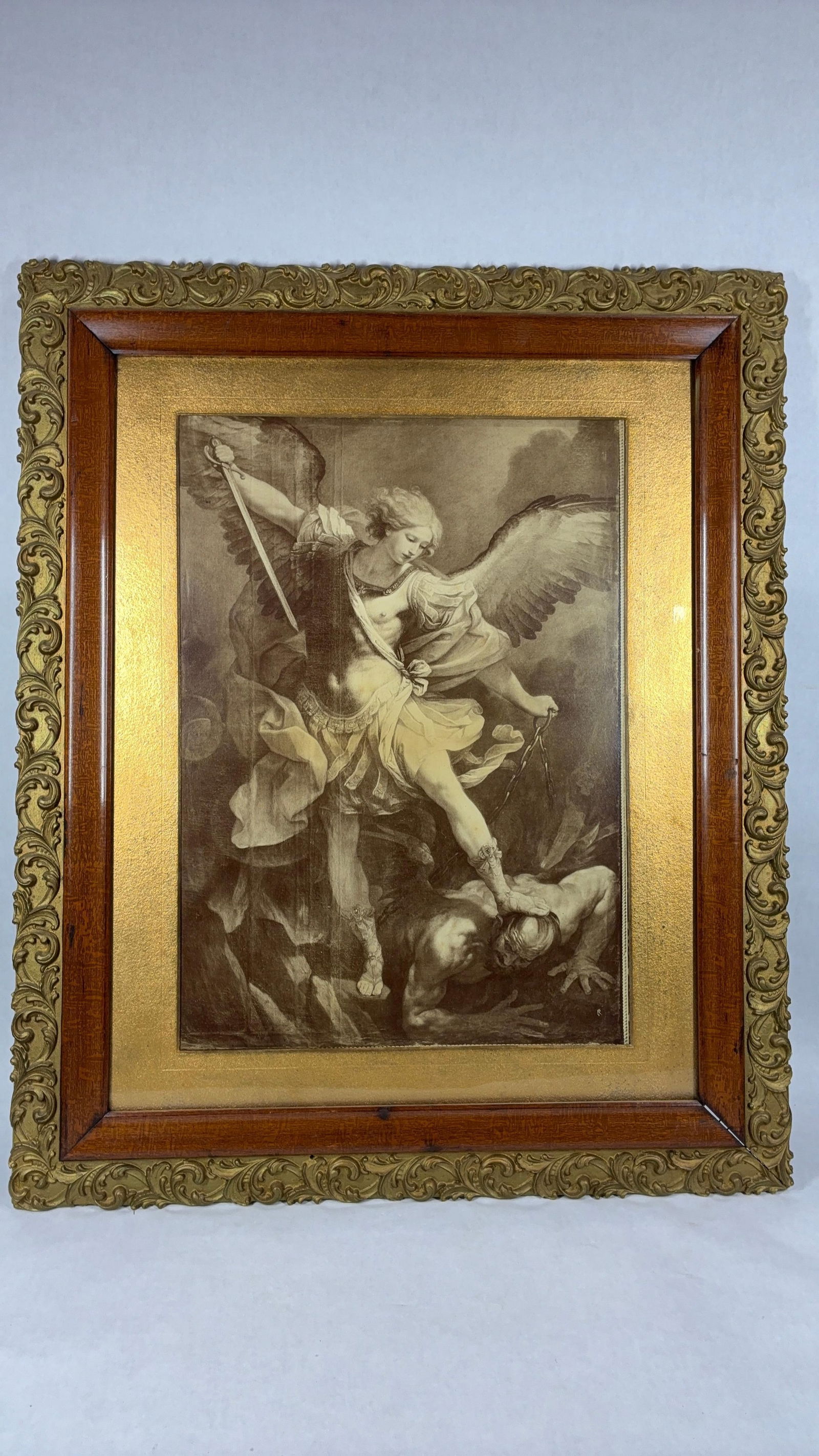 The Archangel Michael Defeating Satan Framed Print: By artist Guido Reni. Framing features a gold carved and oak border. 31x25