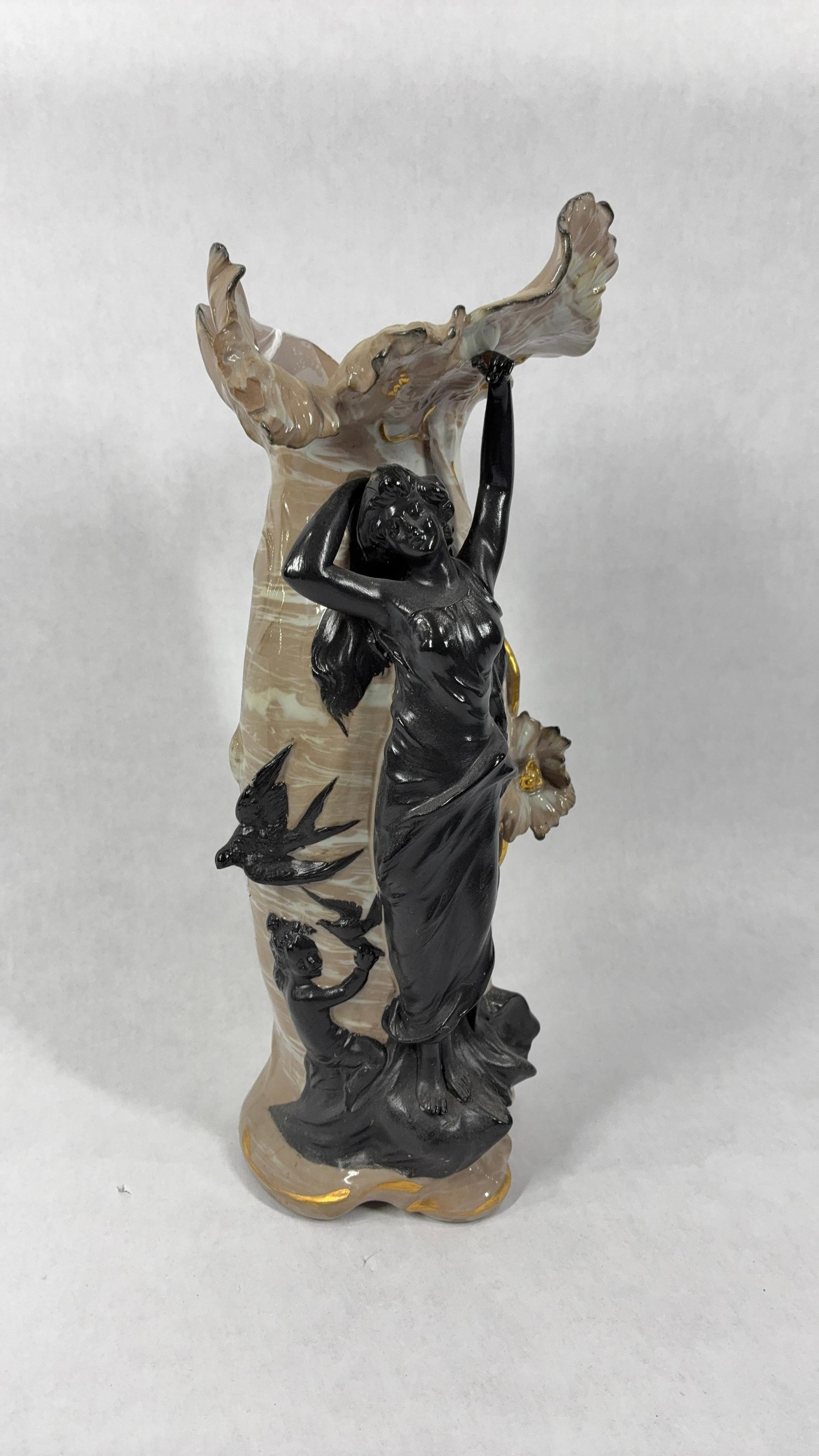 Chocolate Glass Art Nouveau Vase w Female FIgure & Cherub: A whimsical design with flowing hair, birds, and she'll like motifs. Bottom is stamped 9911. 11 inches tall. One small chip to upper rim.