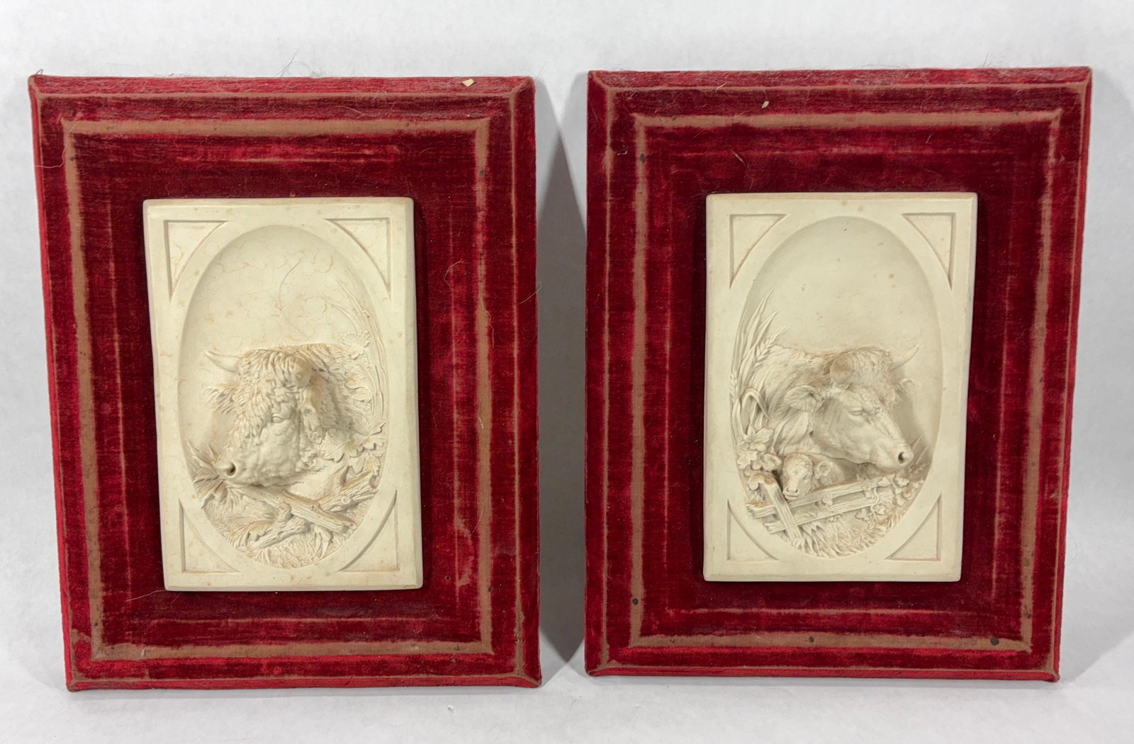 1883 James Priestman Porcelain Cattle Sculptures: Each framed piece features 3D bull images. Back of one shows a copyright tag of 1883 by DF Hayes. Framed in a velvet frame each porcelain plaque is 9x6. Only one other pair of these were found online
