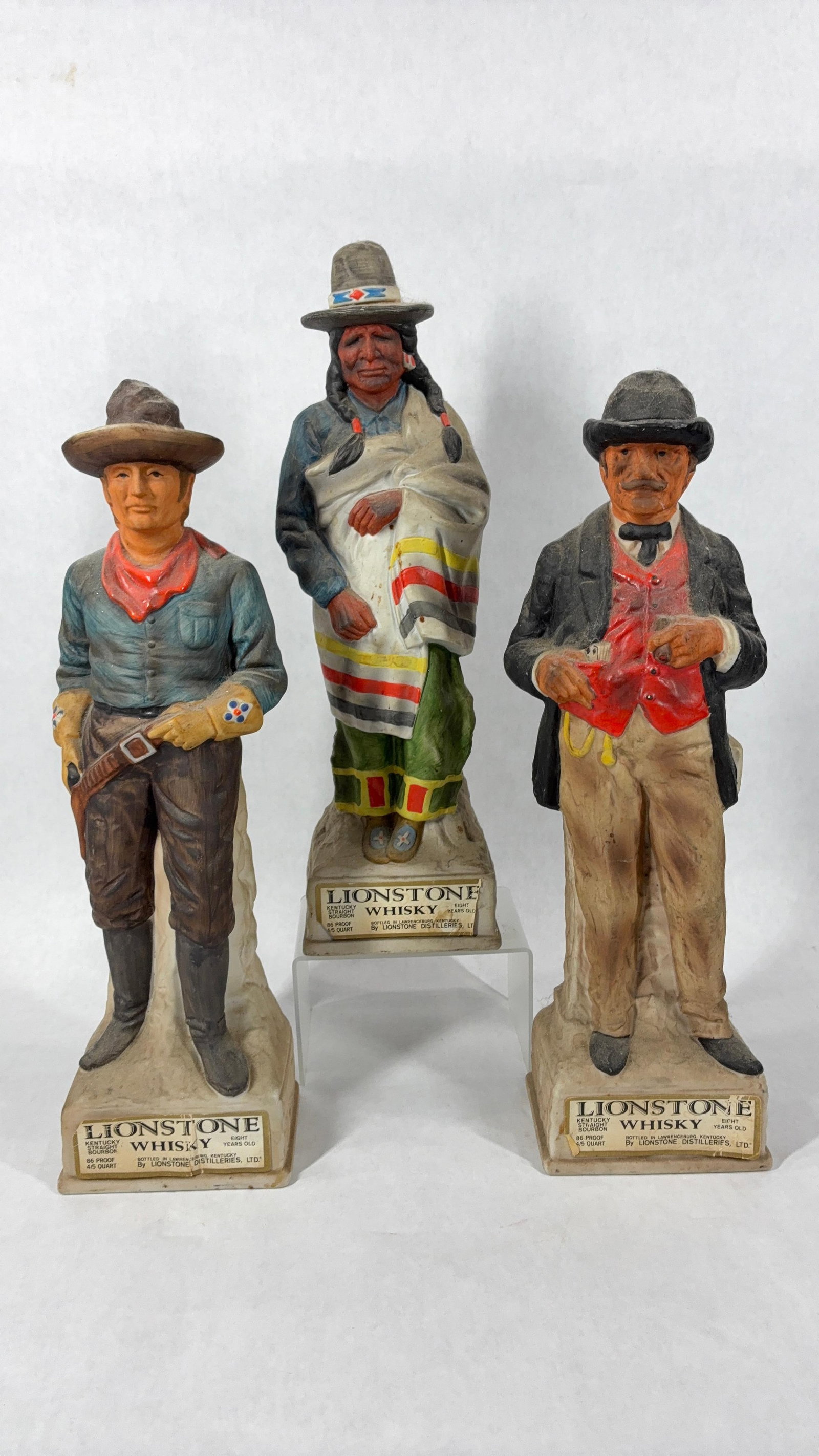 Lionstone Old West Series Whiskey Decanter Bottles: Including Proud Indian, Cowboy Cavalry Scout, and Gentleman Gambler. Each is approx 14 inches tall