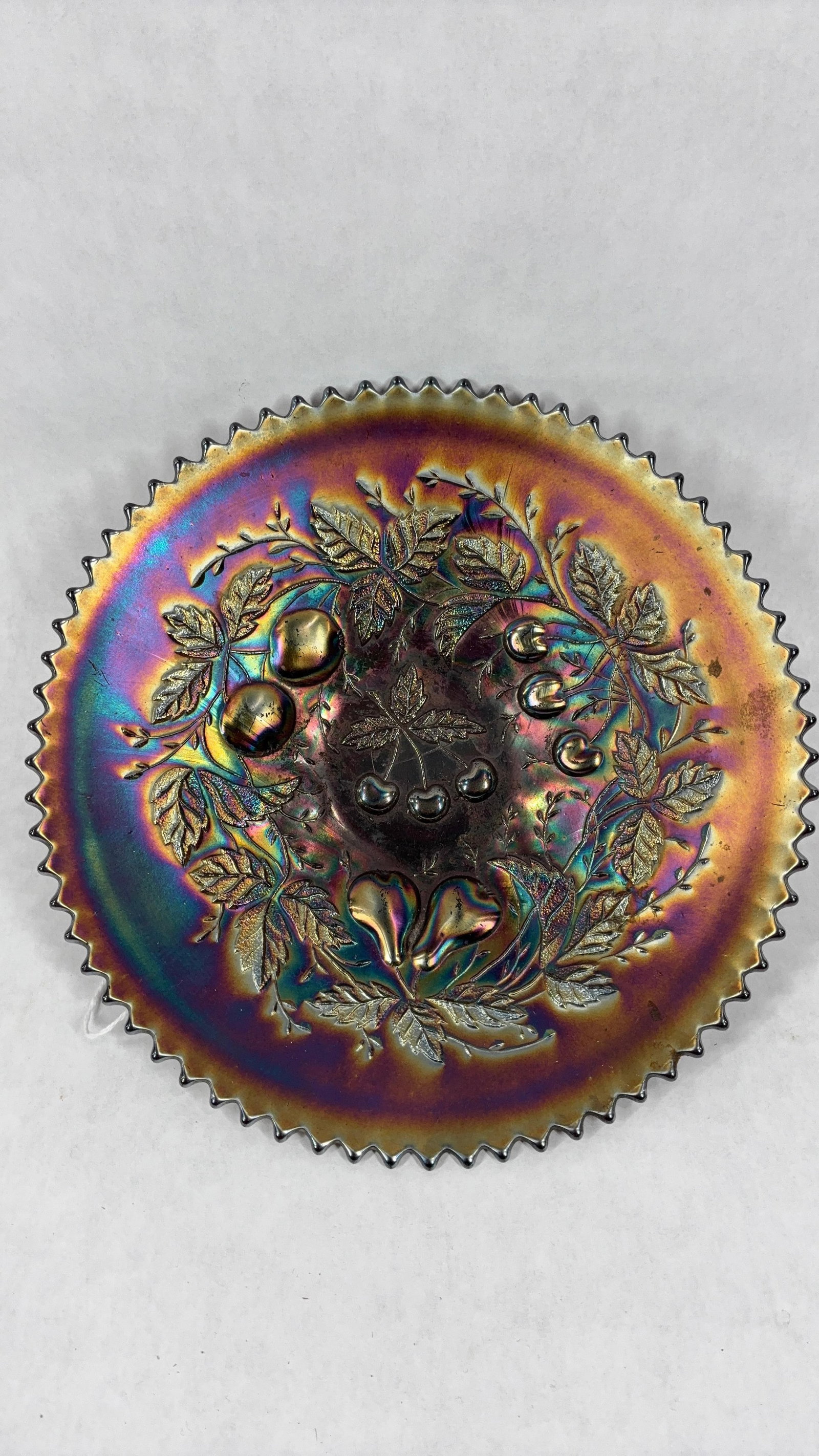 Northwood Three Fruits Amethyst Sawtooth Dish: Great fruit and leaf pattern. 9 inch diameter. A few snags along bottom base but no chips or cracks