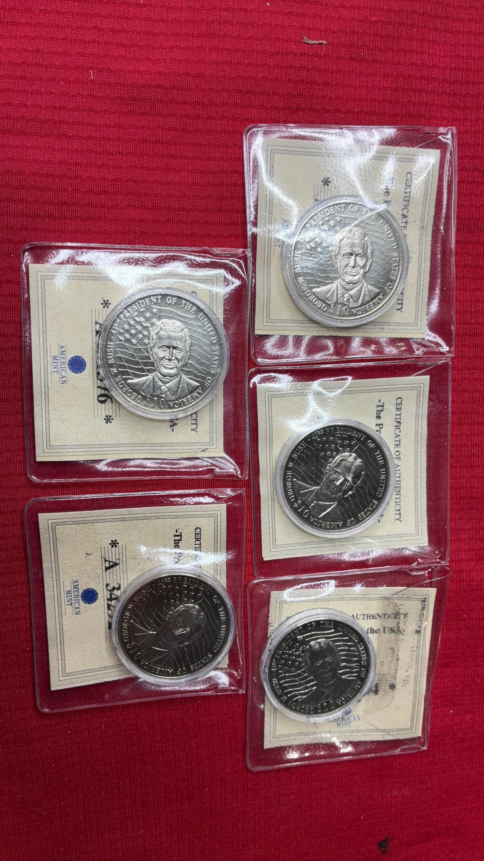 George Bush $10 Proof Coins: 5 coins, copper-nickel, uncirculated with certificate of authenticity.