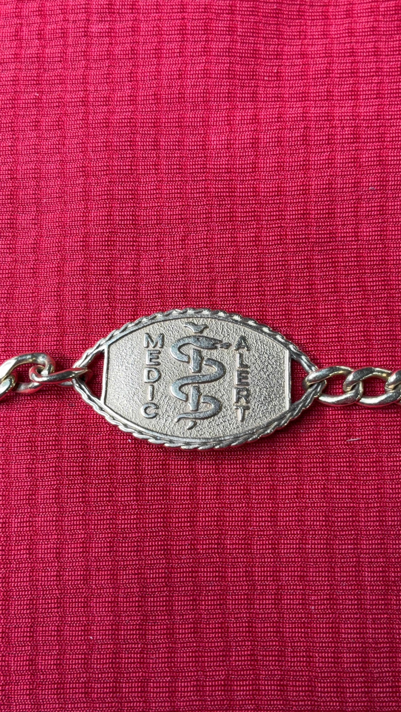 14K Gold Medic Alert Bracelet: Marked 14K on center medallion and well as chain and clasps. 15.7 grams