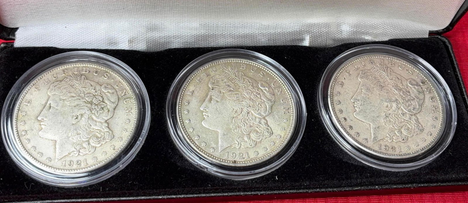 Morgan Silver Dollars with Case: 3 coins, 2-1921 S, and 1- 1921