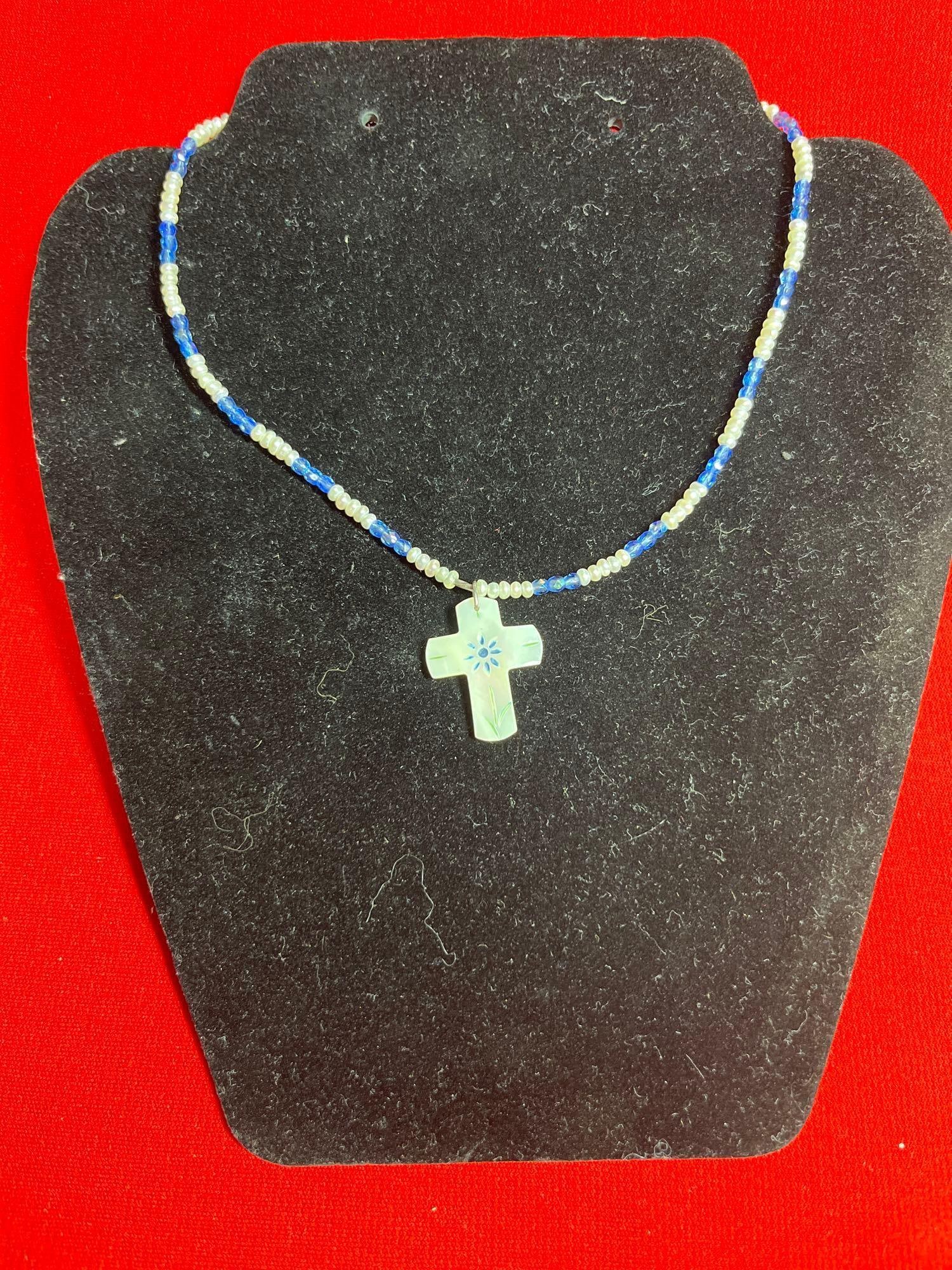 Mother of Pearl Cross w Freshwater Pearls & Sterling: A dainty beaded necklace with mother of pearl pendant and sterling clasps.