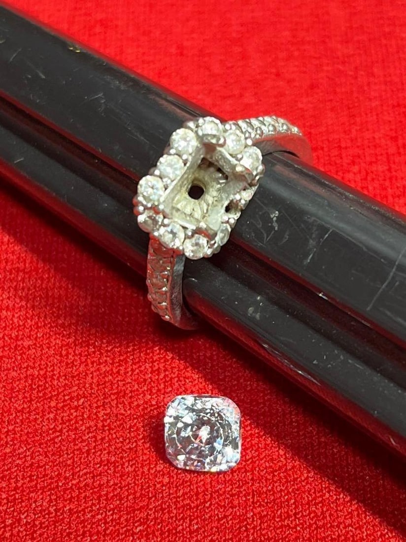 Sterling Engagement Band & Stone-For scrap: This has been damaged, features a large CZ stone with many surrounding stones. Marked .925. Stone is clear and shows no chips. Approx 4.4 grams. Size 8