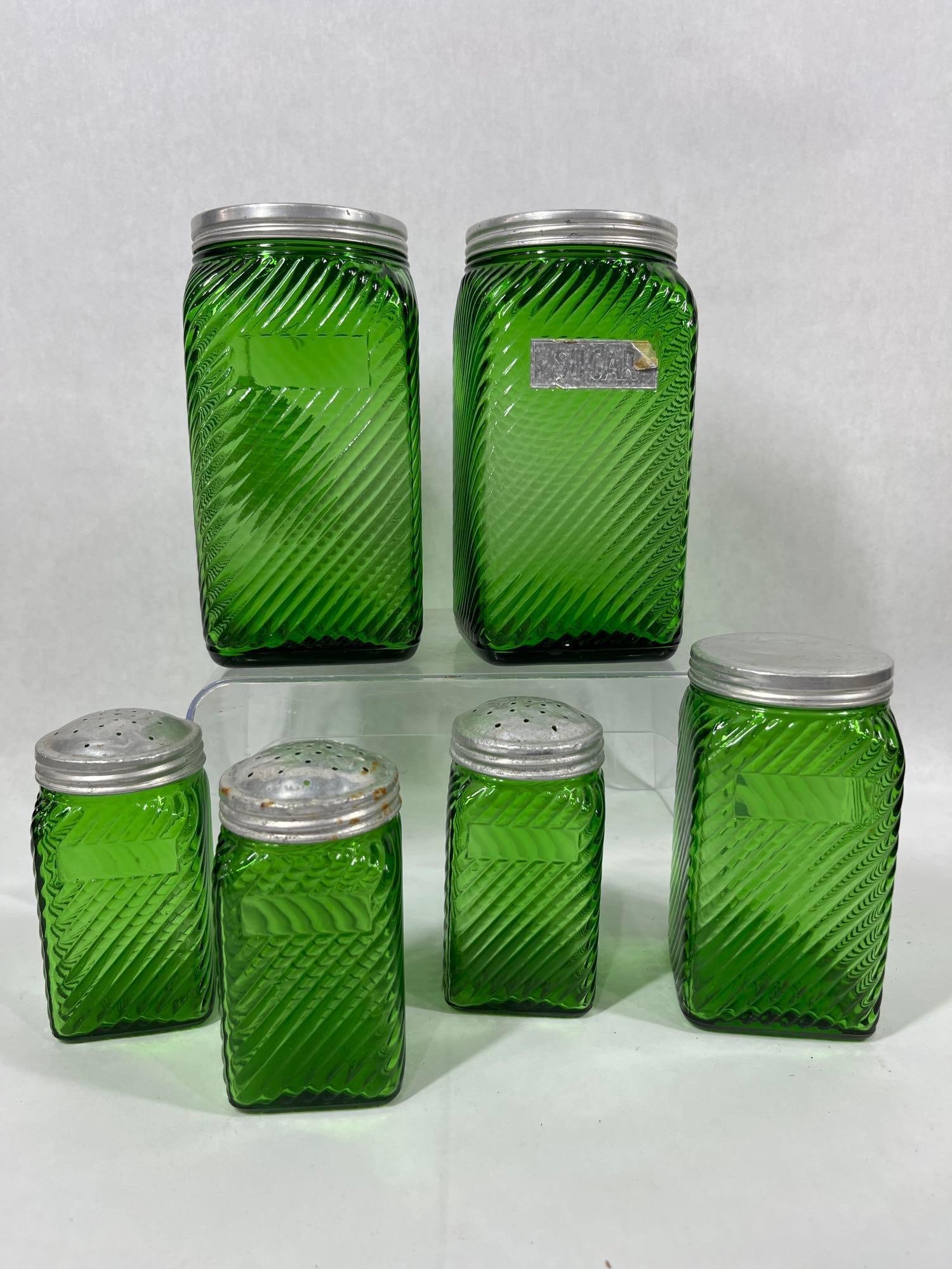Owens Illinois Green Glass Shakers & Hoosier Jar Set: Produced 1930s-1950s. Three shakers and 4 jars. Each appears to be in good condition.