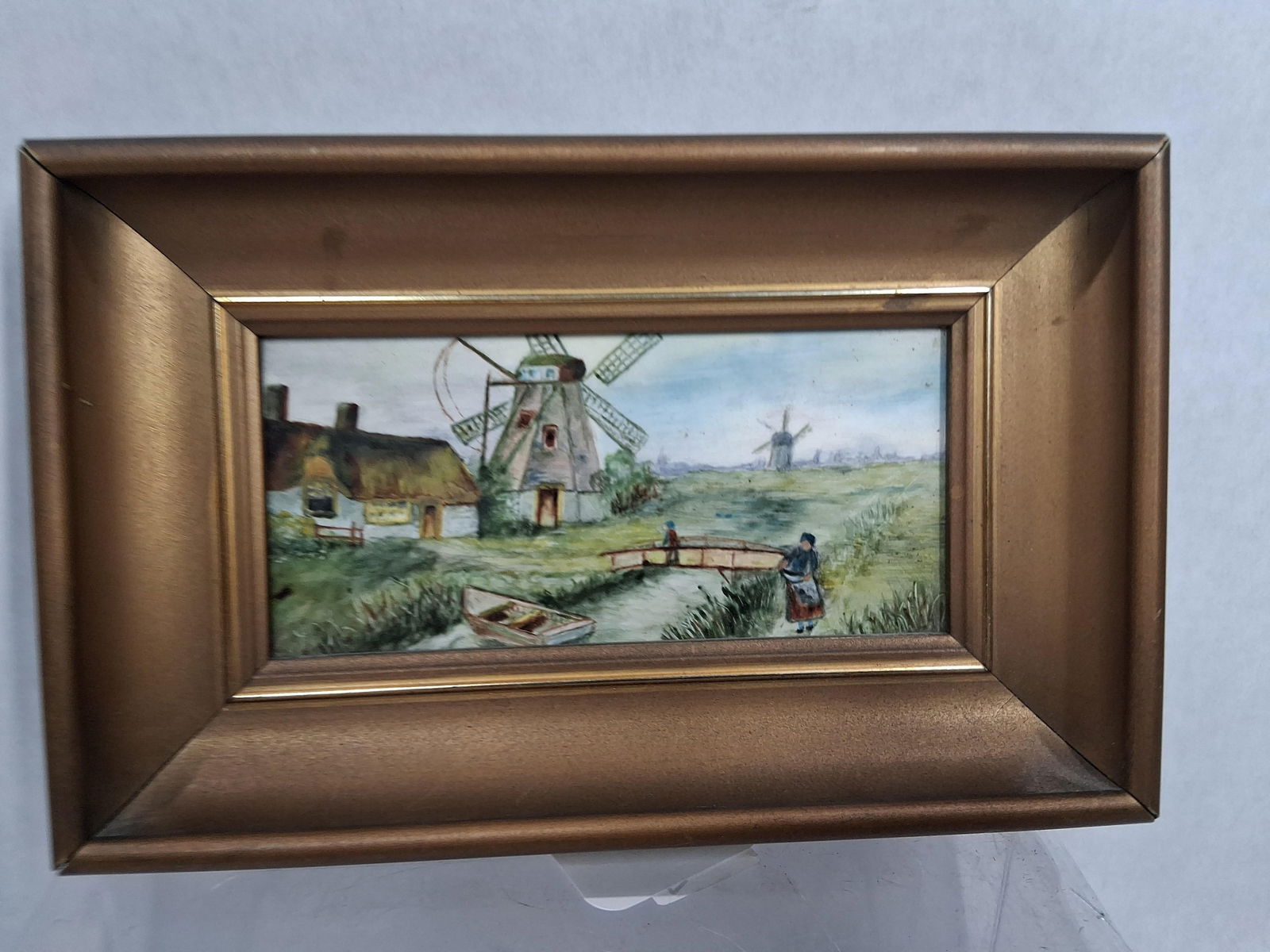 Early Hand Painted Framed Holland Porcelain Tile: Depicting windmill and cottage in a small deep well frame measuring 5.5 x 8.5