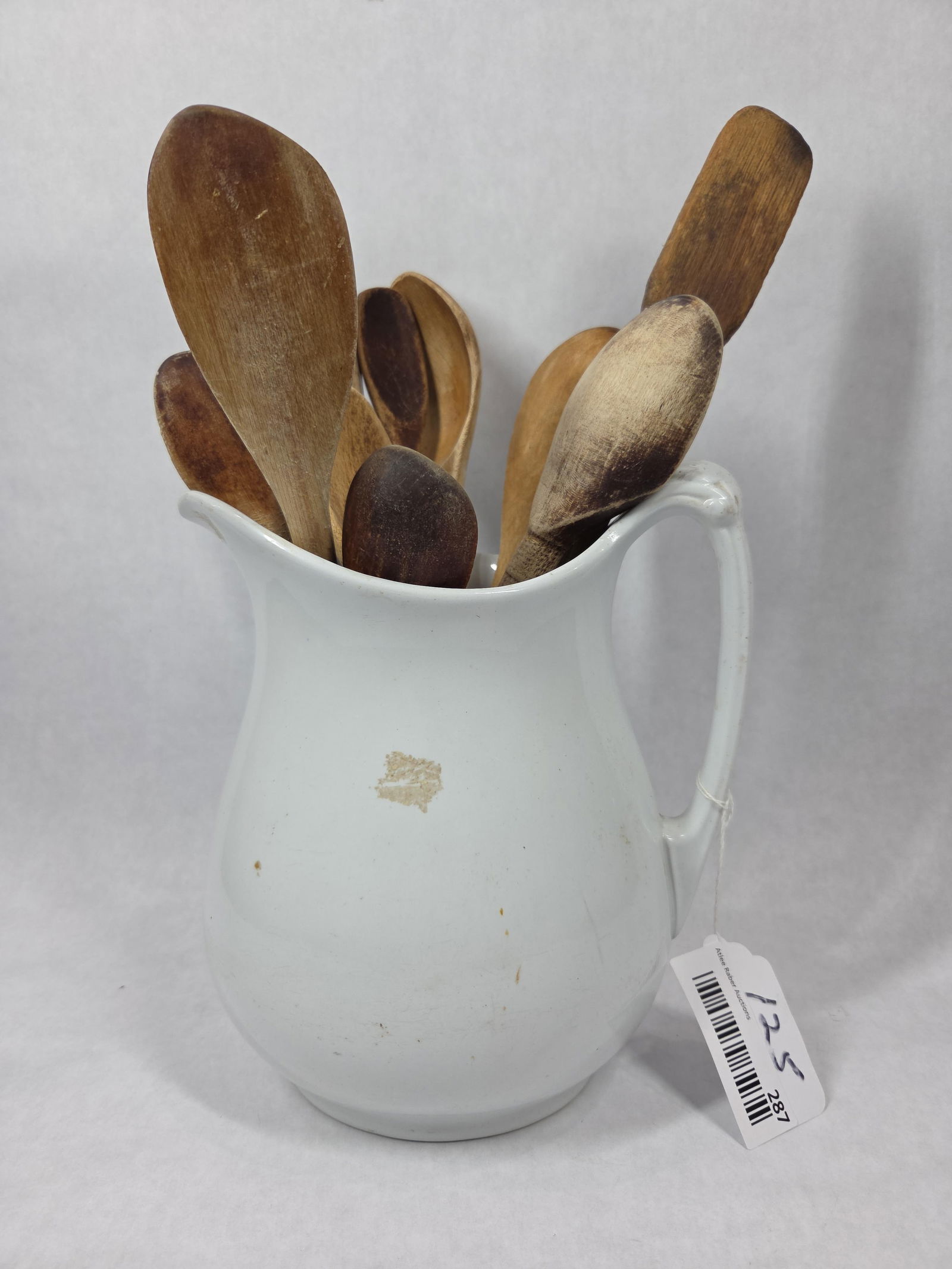 Iron Stone Pitcher w Olde Wooden Spoons: Alfred Meakin England Royal ironstone pitcher. 9.5 inches tall, with no visible cracks or chips. Included are 10 old wooden spoons showing lots of character.