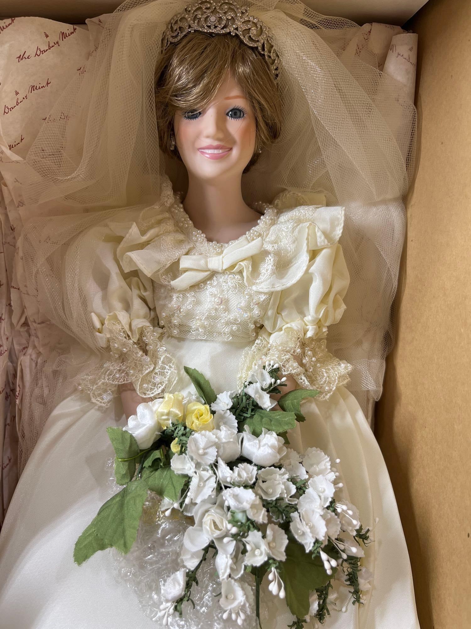 The Danbury Mint Collection Princess Diana NOS Porcelain Bride Doll: This great collectible Royalty Doll is still in original box wearing a stunning remake of her original Wedding gown including tiara and flowers including a display base she stands 20 in H