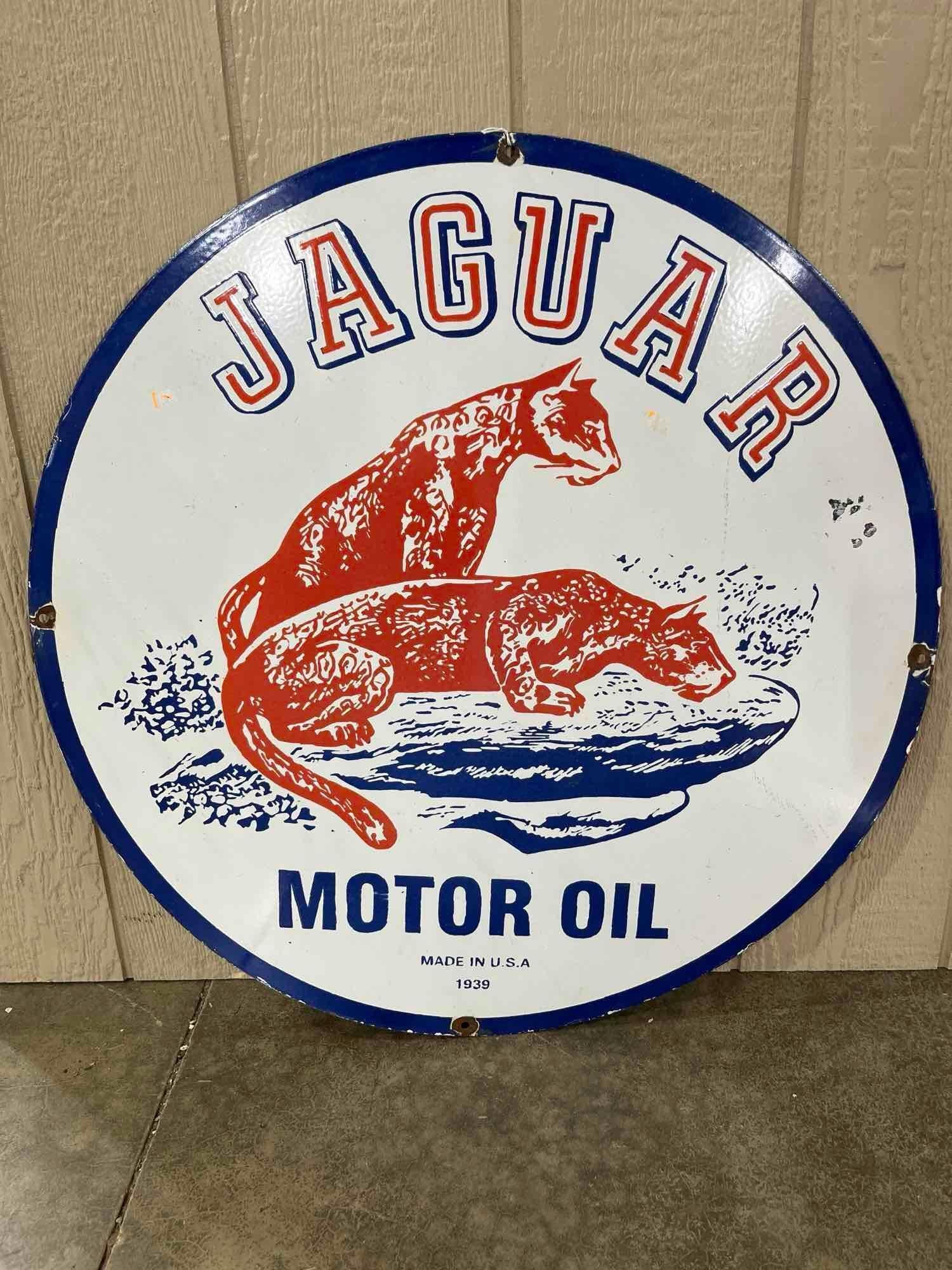 Porcelain Jaguar Motor Oil Sign: Several hits around mounting holes. This is a newer sign. 30 inch diameter