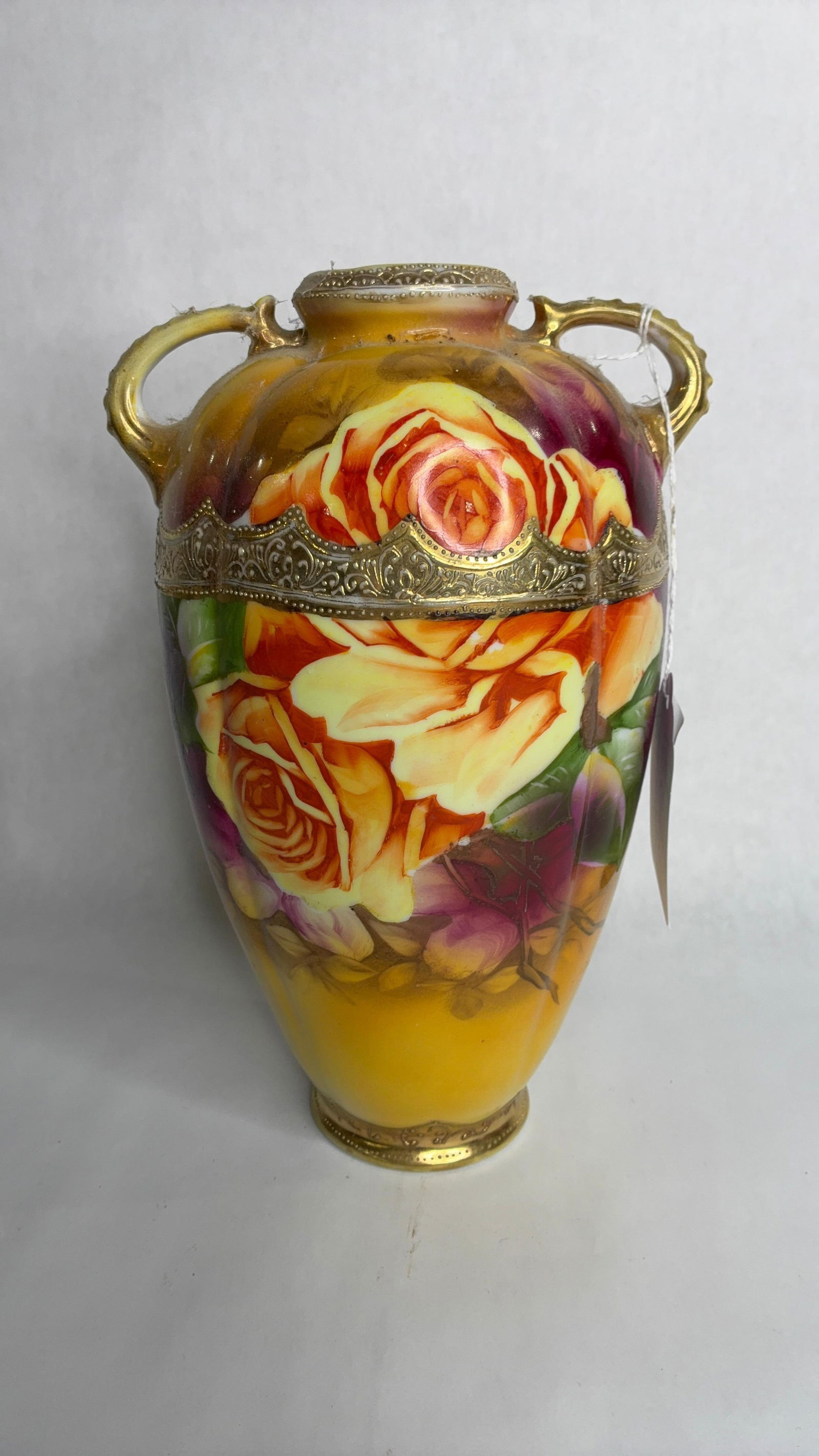 Early 20th C. Hand Painted Double Handled Nippon Floral Vase w/ Gold Accents: Great overall condition with no chips, cracks or breaks. standing 10 in. H