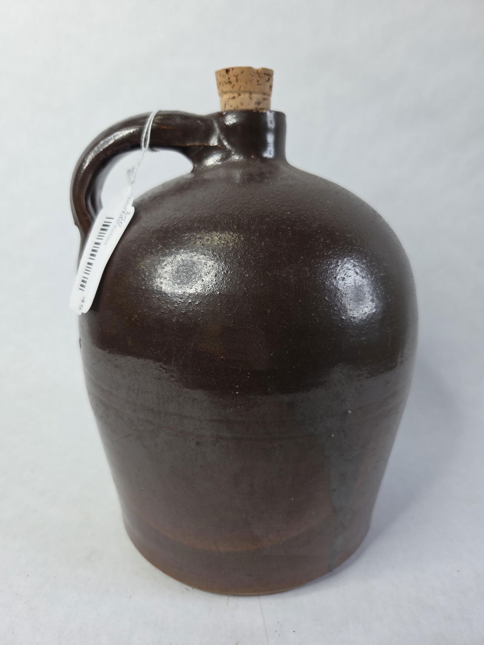 Brown Stoneware Jug with Cork: 1 gal, excellent condition, 10 in high