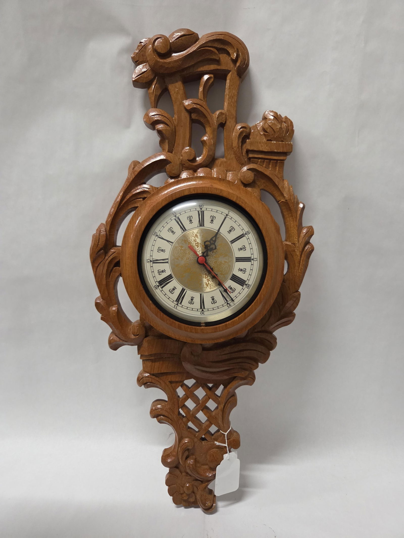 Hand carved wooden wall clock with battery movement: Very detailed hand carved clock in running condition 30 in long