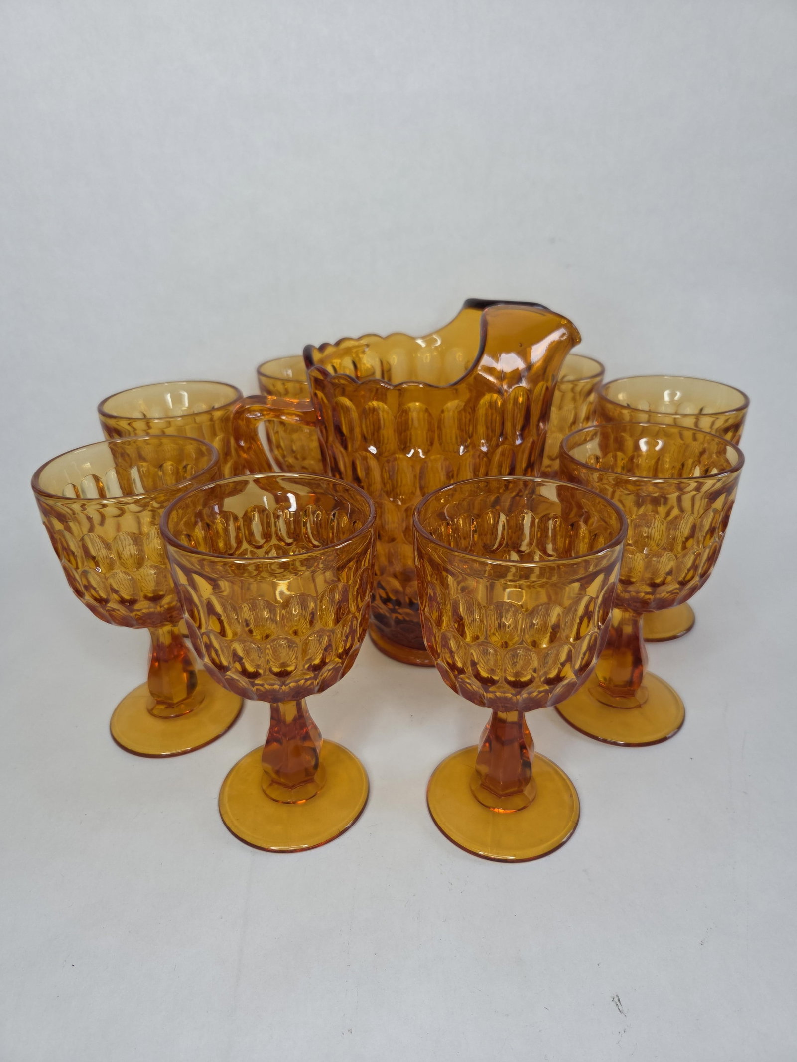 Fenton colonial amber thumbprint water set: Set includes pitcher and eight goblets