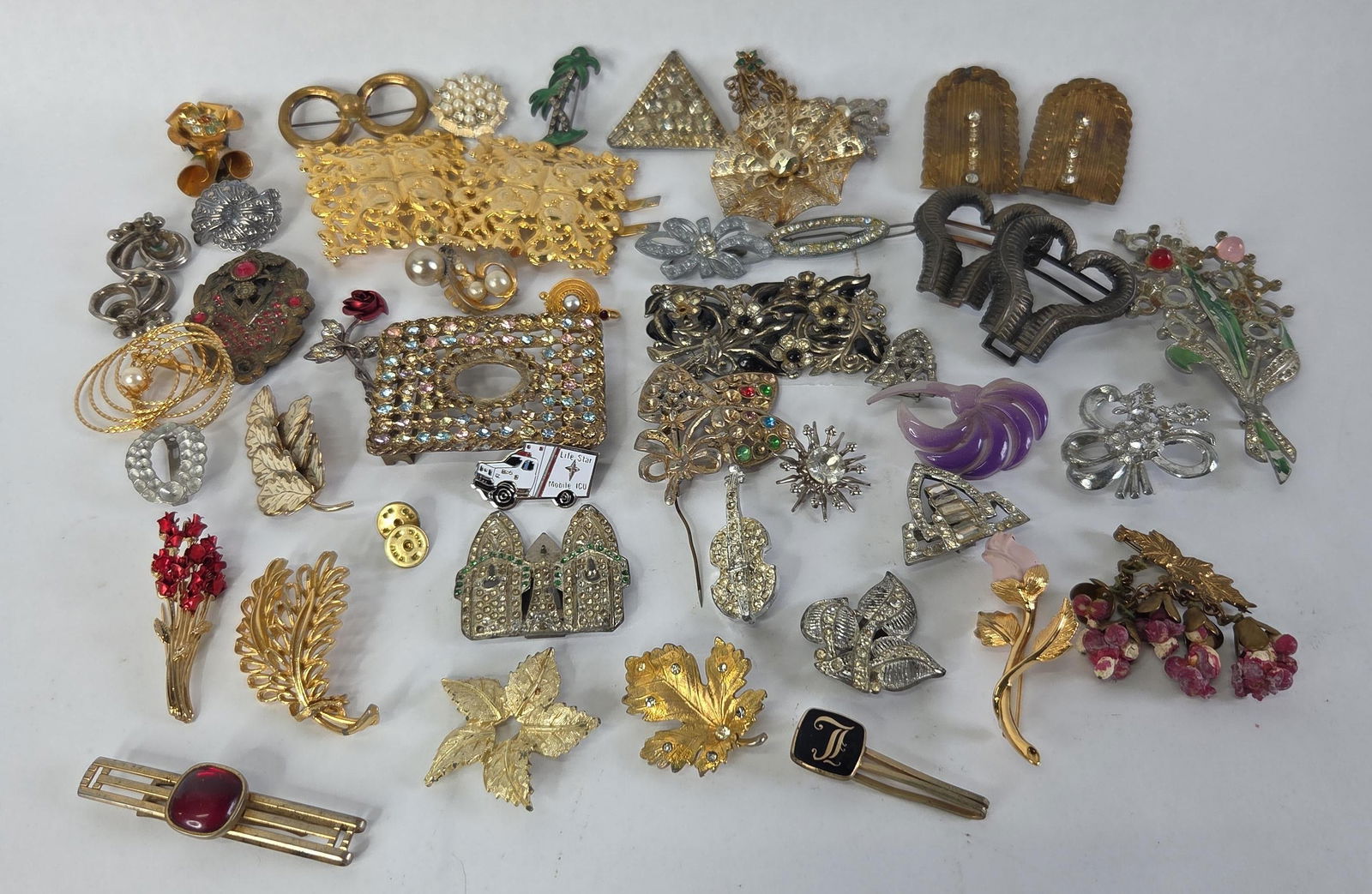 Pins and brooches: See photos