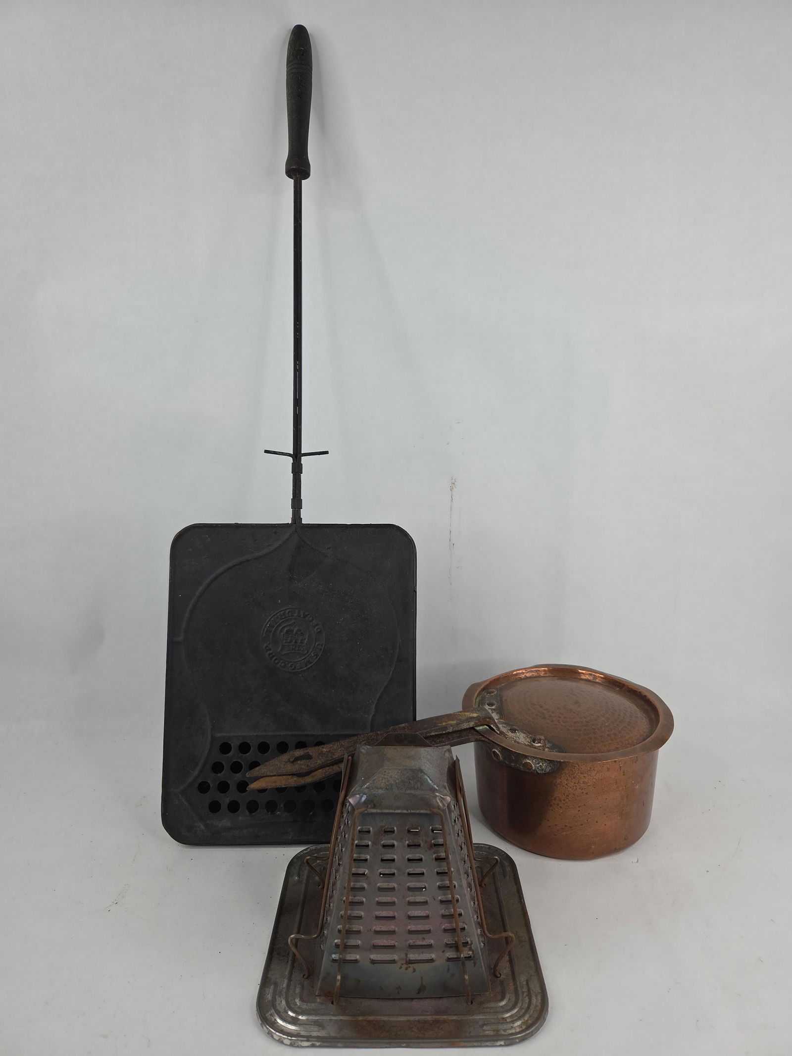 Copper lidded pan ,Tin toaster and the US line popcorn popper: .