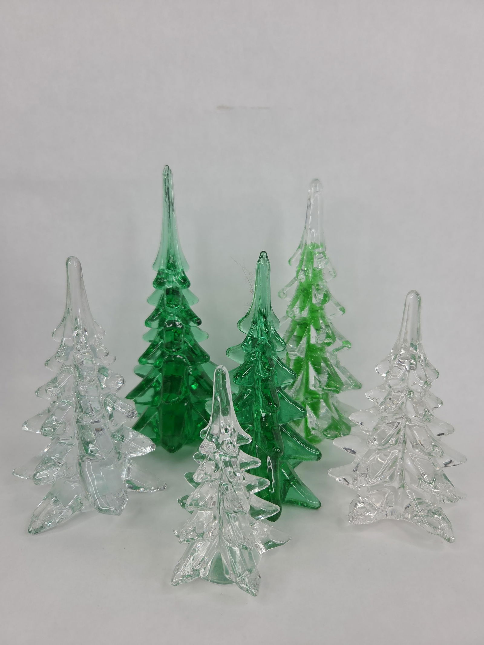6 Studio Art blown crystal glass green and clear Christmas trees: heights ranges from 8 in to 4 inches