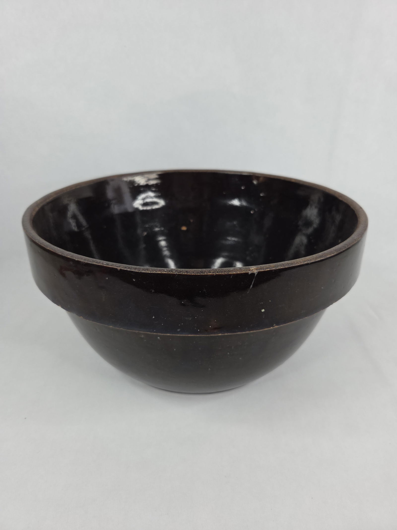 Large 12 in brown glazed stoneware bowl: structurally sound no chips or cracks