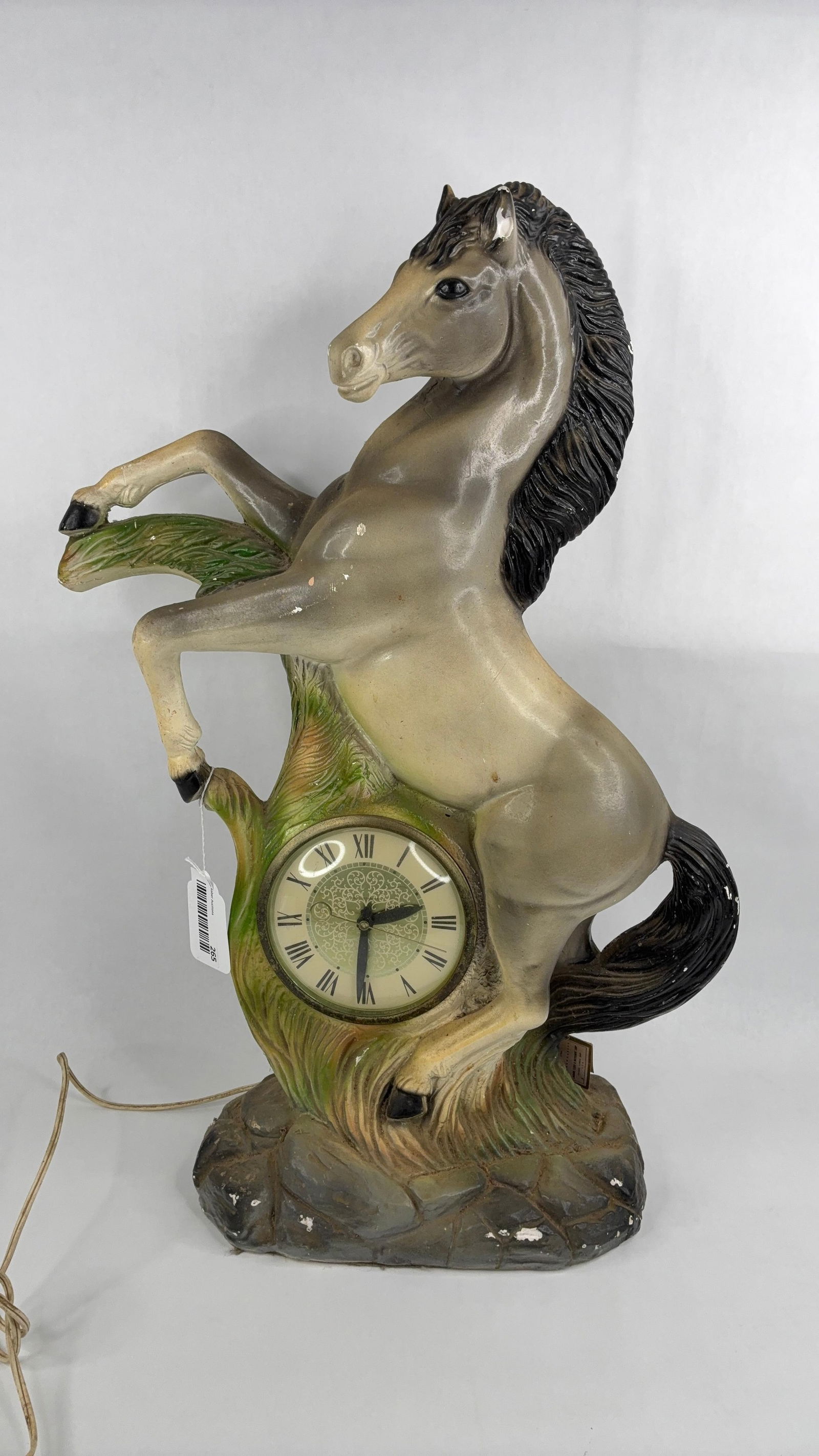 Vintage chalkware Lan shire movement rearing stallion clock: clock is not in running condition has some dust accumulation and a few chip missing but displays well