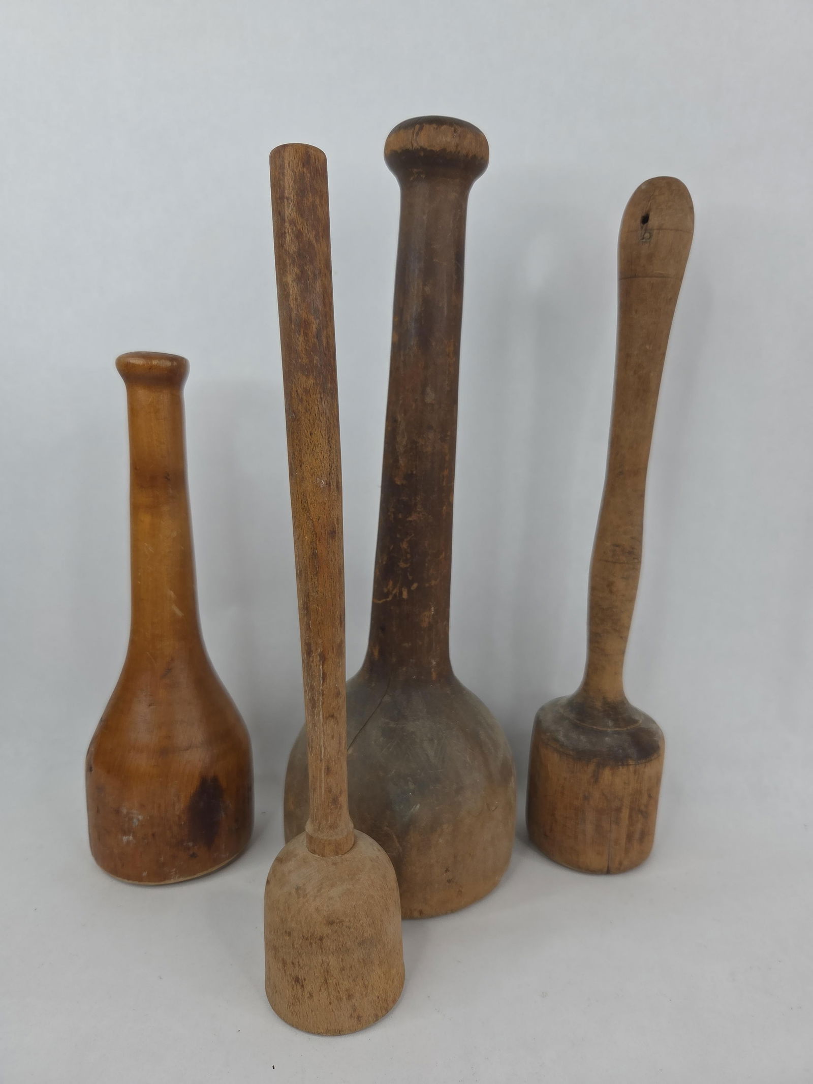 Primitive wooden pestles and mashers: largest is 14 long and 5 in diameter