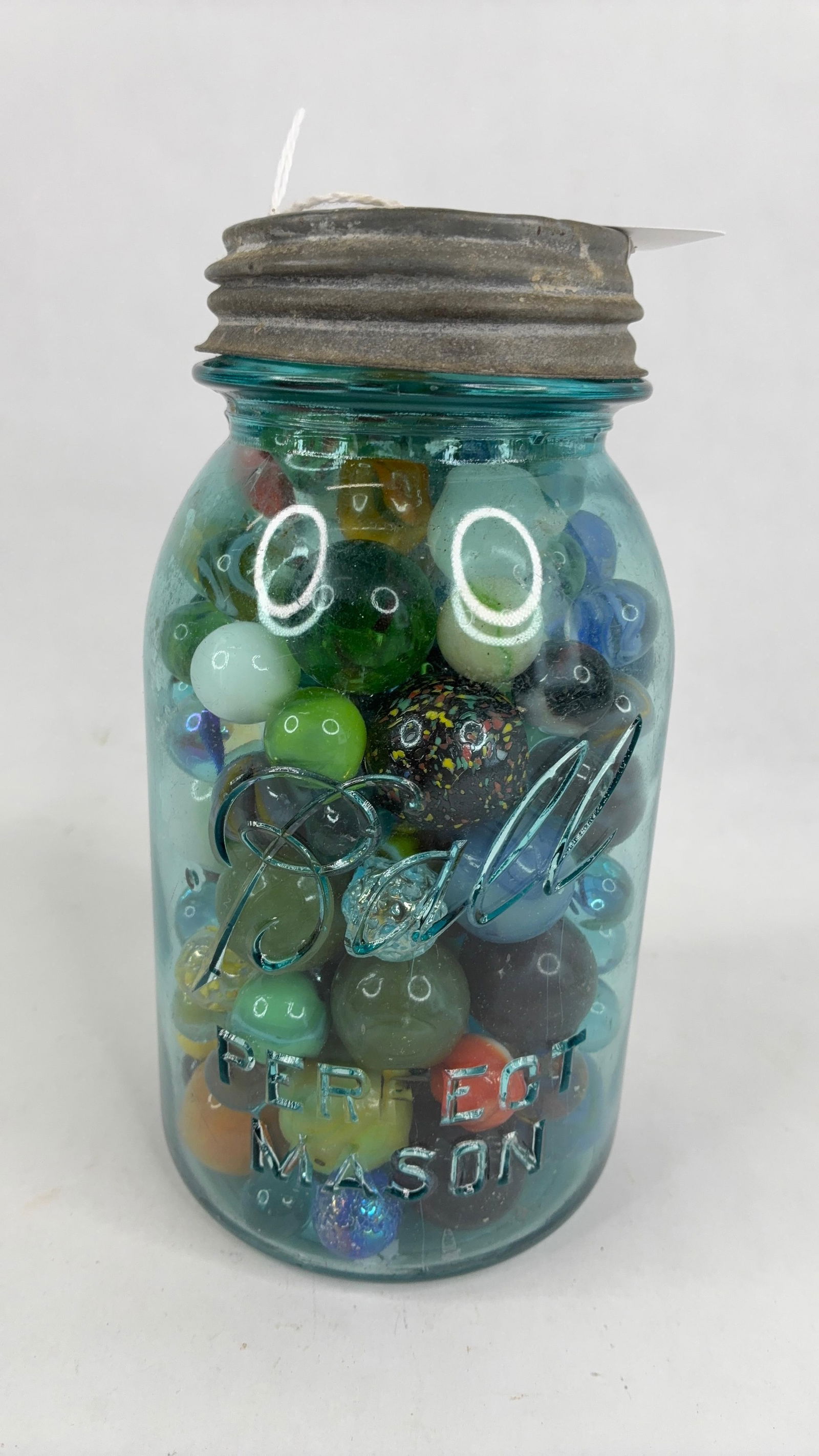 Blue #10 ball jar with various sized marbles: .