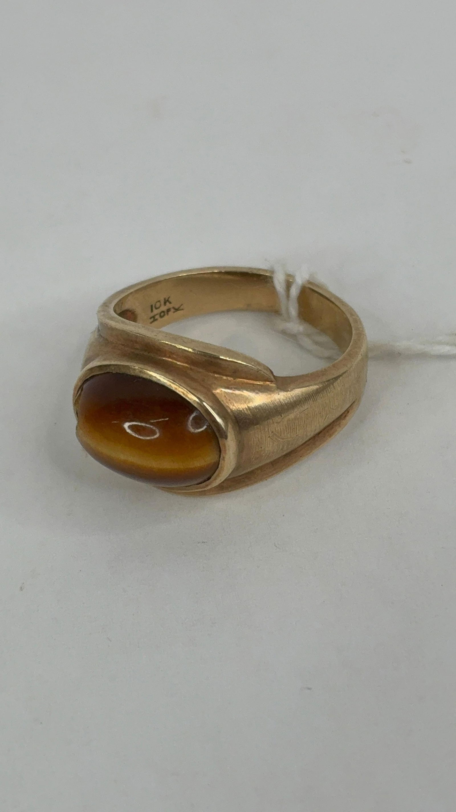 10K gold tiger eye stone men's ring: stone has a small chip missing total weight7gram