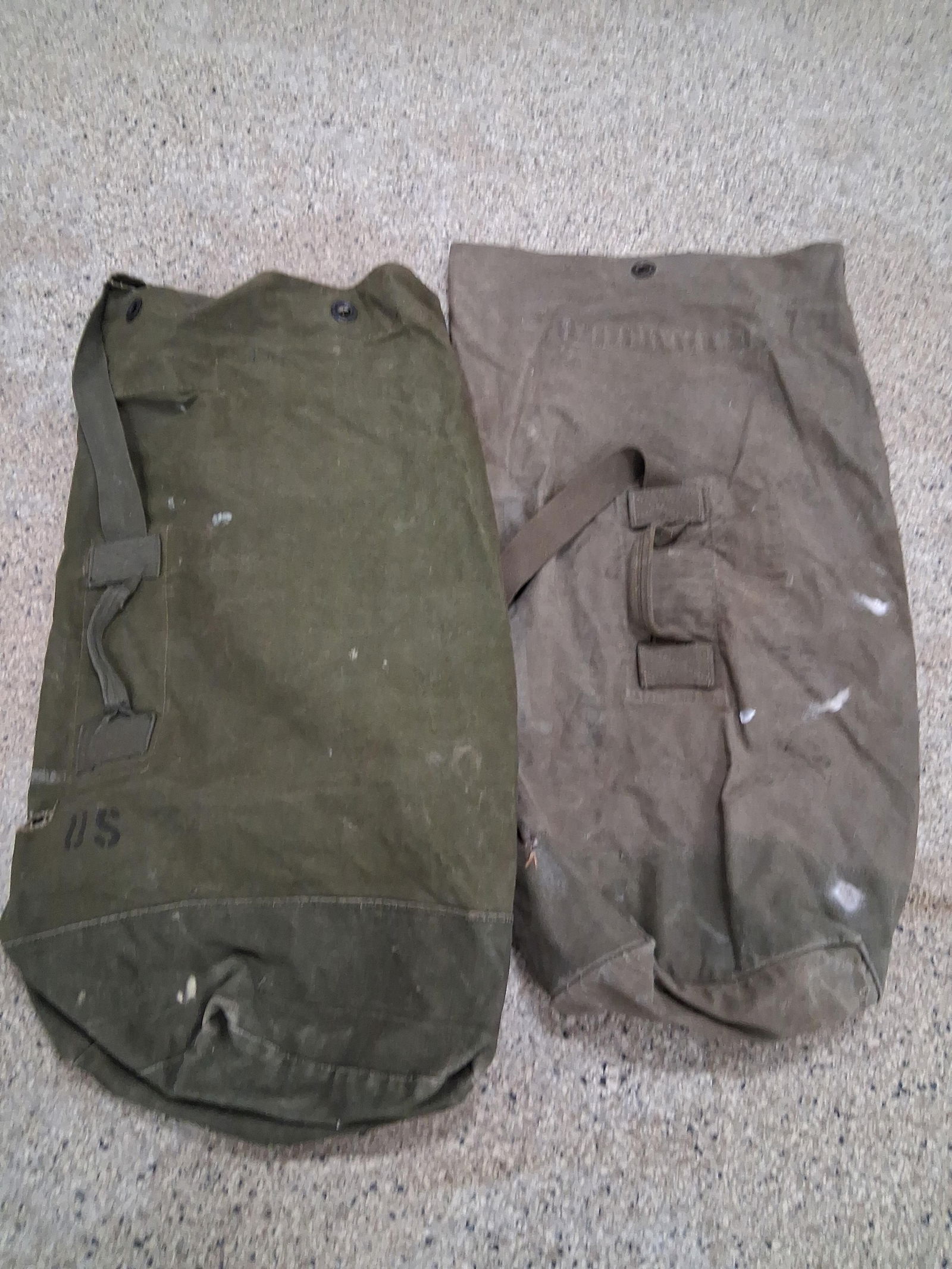 2 US Army Duffle Bags: 1 Roger H Cook other marked FRY both show some storage issues small hole in one
