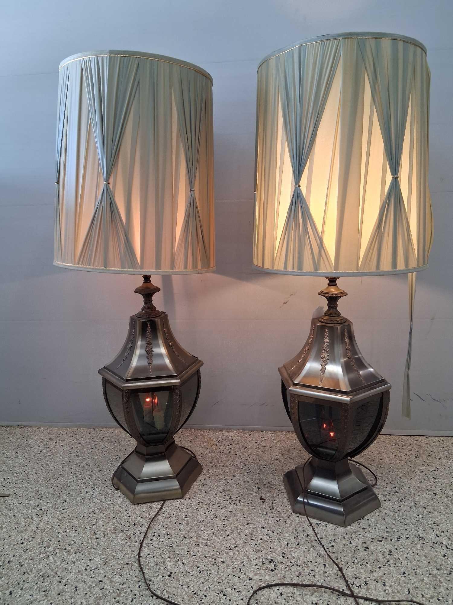 Mid century modern silver toned urn style table lamps: Both are in good working condition 3 light setting bright light setting or flicker candle light in base