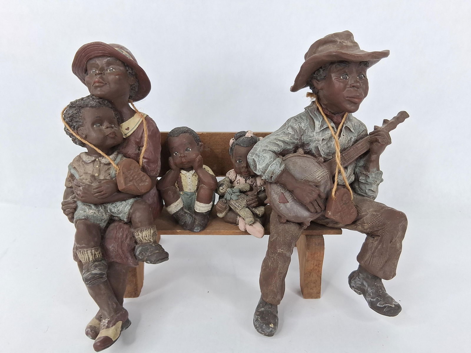 Sarah Attic American family limited edition figurines and wooden bench: all are numbered