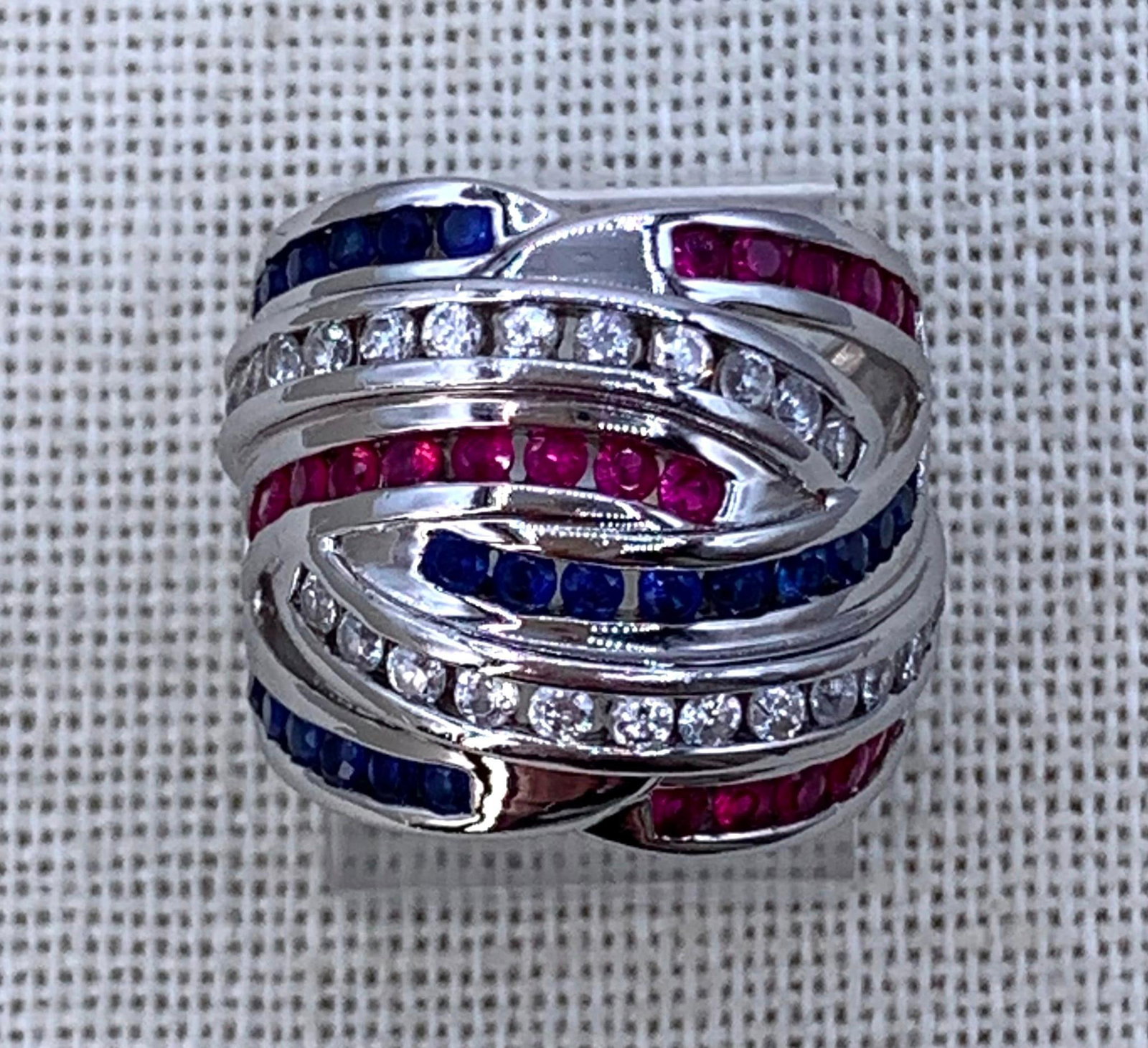 Superb Sterling Silver Channel Set Glittering Gemstone Woven Wide Cigar Band Ross Simons Ring: 925 hallmark, 5.25 size, 3/4" length along the finger, 7.7 gram weight, beautiful created sapphire, ruby and cz gemstones with rich hues and fantastic sparkle, Ross Simons designed.