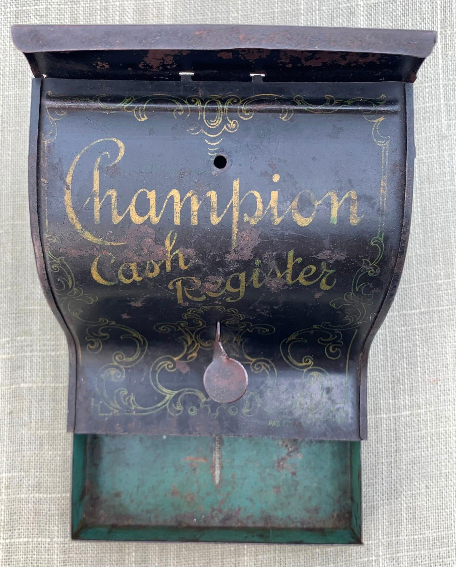 Antique c1900 Miniature Champion Cash Register Tin Toy: 3 5/8" x 3 5/8" x 3 1/2", ornate gilded lettering and detail, working push button drawer mechanism.