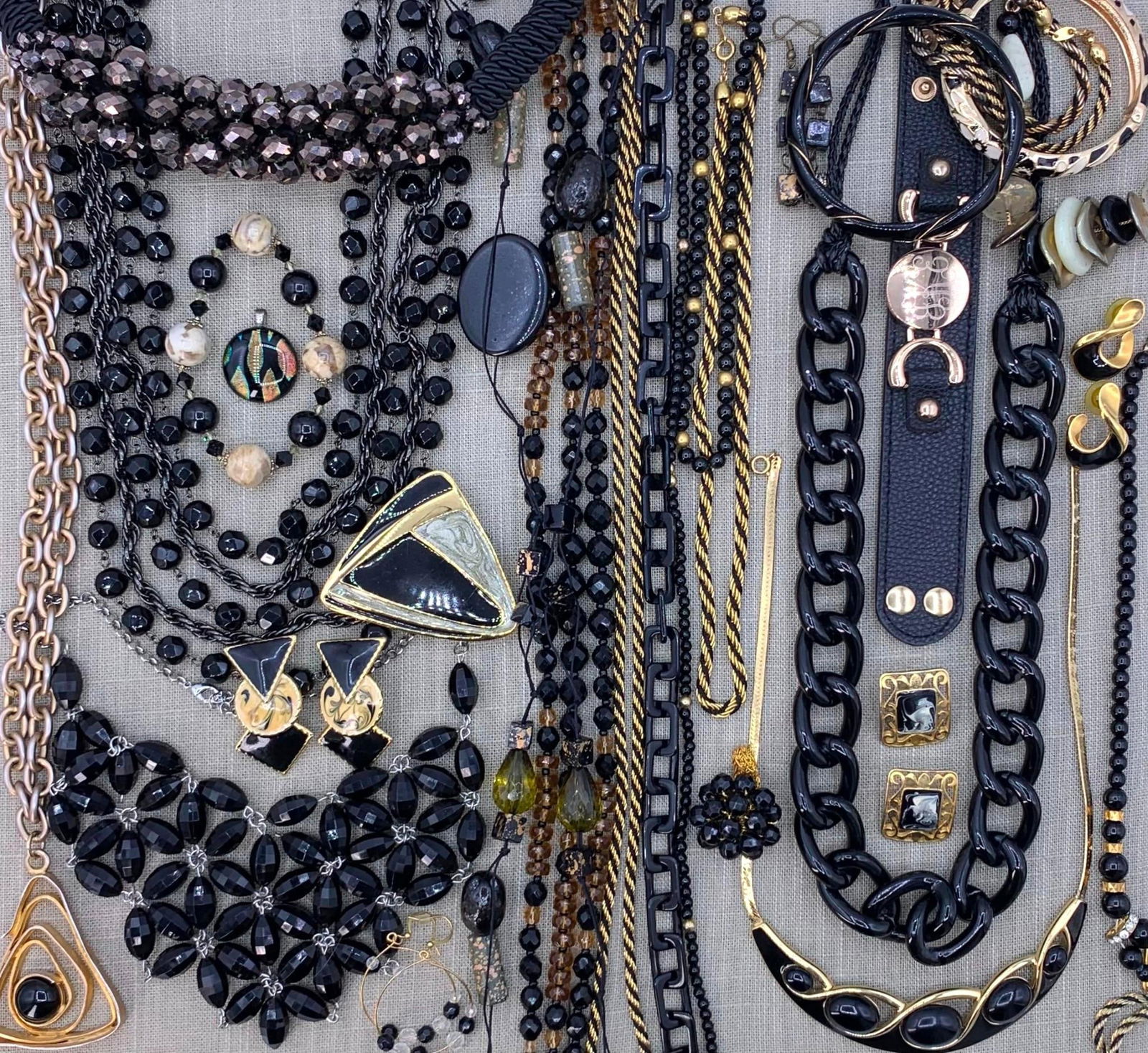 41 pc Black, Gold Amber Vintage Costume Jewelry Collection: Trifari, art glass, faceted glass and crystal, enamel, Mid Century to 90s, bold collar necklaces, layered and draped adornments, chunky link and golden serpentine, dramatic pierced earrings, large pen