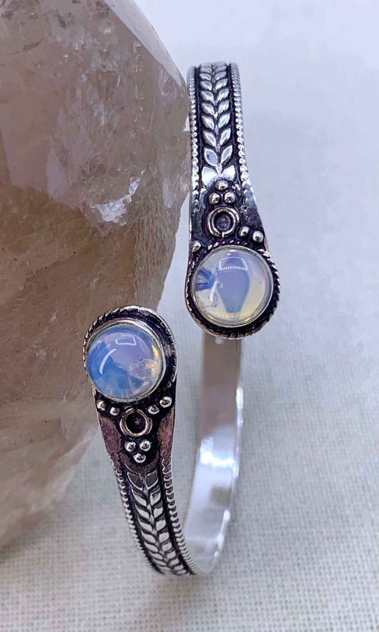 Luminous Sterling Silver Bypass Opaline Cabochon Bangle Bracelet: 925 hallmark, 7.5mm Opaline gemstone cabochons, 12.2 gram weight, 2 1/2" interior width.