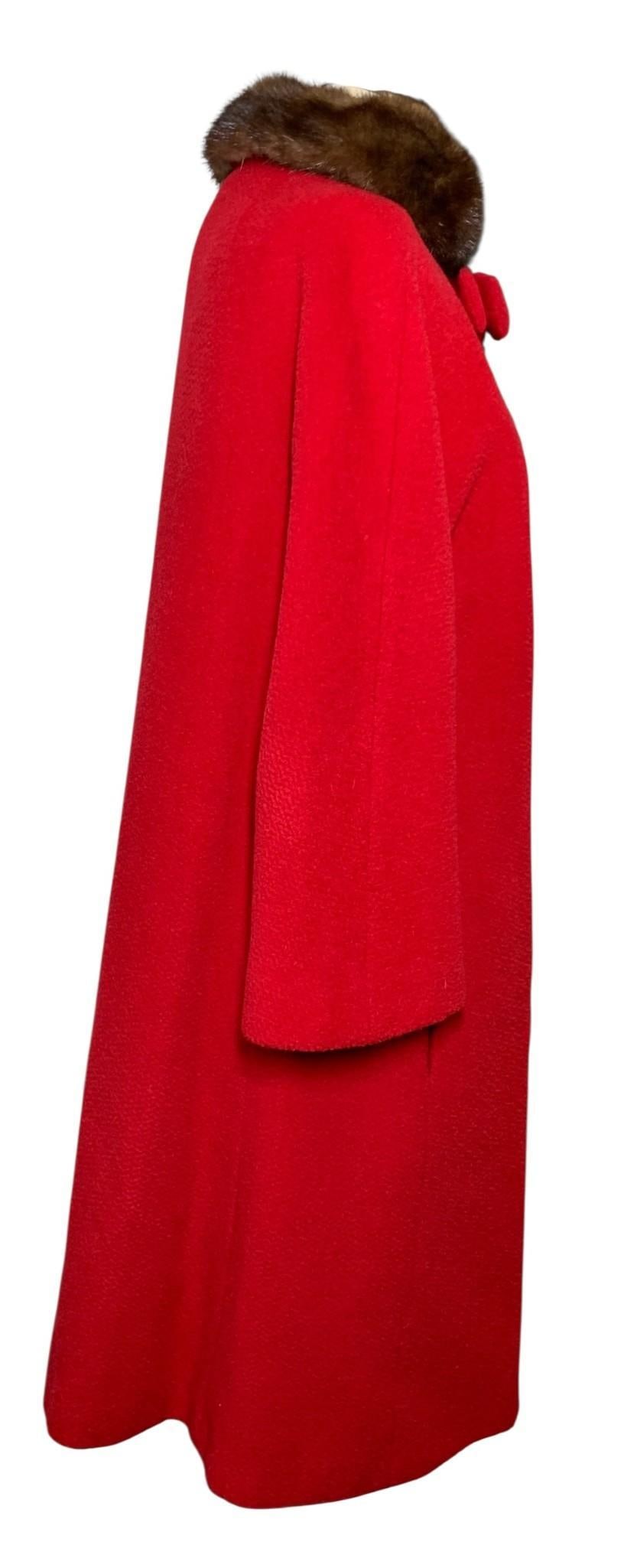 Luxe Mid Century Red Boucle Wool Mink Fur Trimmed Bow Accent Vintage Ladies Swing Coat: Fully lined, pair of usable pockets, bow detail at the throat with button closure, lush mink fur trim, a few small areas of thinning to the ruby red wool, a few stitches needed to secure the bow bette