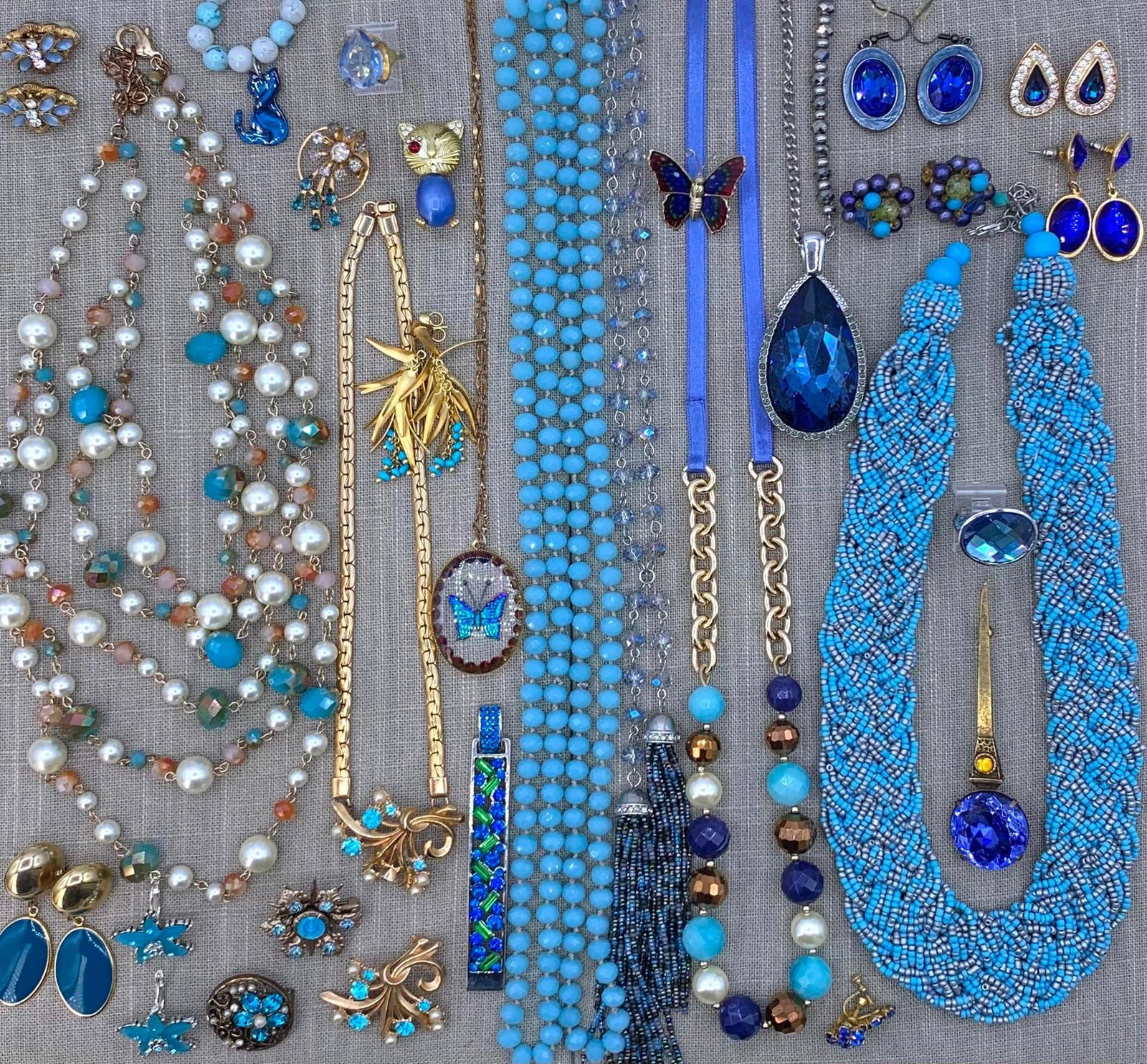 41 pc Azure Sapphire Blue Vintage Costume Jewelry Collection: Faceted crystals, faux pearls, glass seed beads, dramatic layered necklaces, Mid Century baubles, oversize jeweled accessories, pierced and clip earrings, gilded metals, a few with absent stones.nbsp;