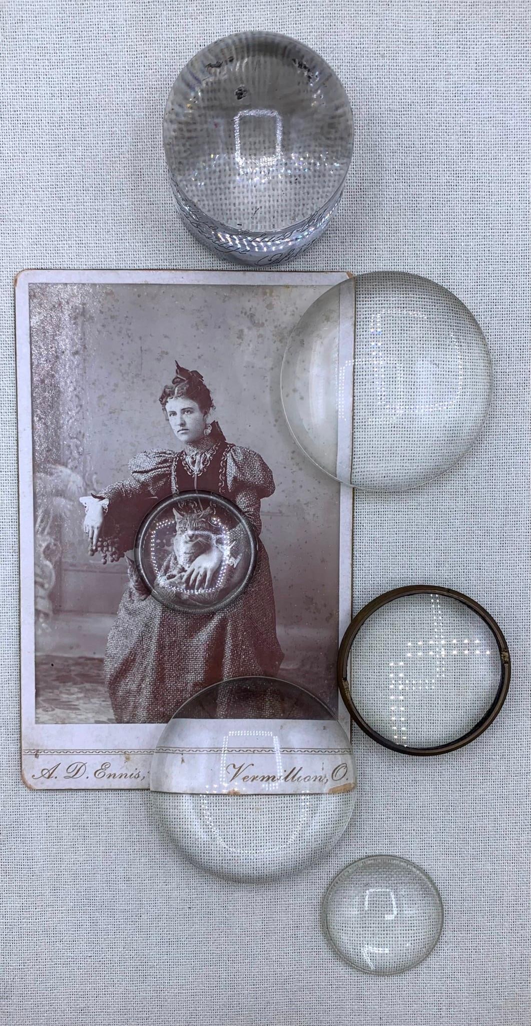 Antique Victorian 1890s Girl with Cats Cabinet Card Early Domed Glass Print Magnifiers: 2 5/8" to 1 5/8" magnifier domes, including a Cambridge Glass Co. Cambridge Ohio Old Home Week Souvenir Oct 2-8 '21 and 1890s cabinet card photograph of a young girl and her 2 cats, Vermillion Ohio st