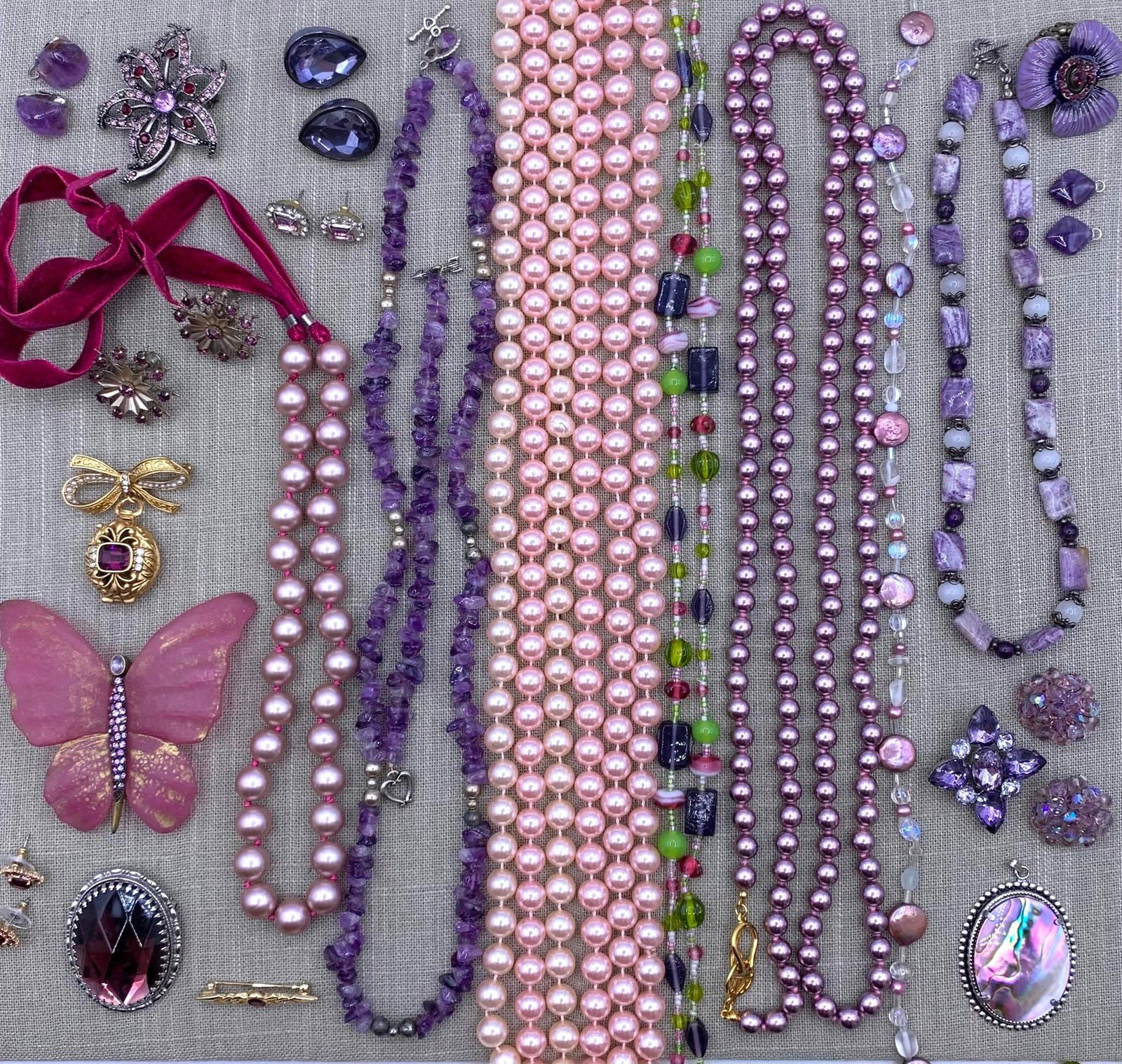 35 pc Kenneth J Lane, Amethyst, Butterfly, Coin Pearl Jewelry Collection: Incredible selection of lavender hued adornments, 52" circumference KJL hand knotted lavender faux pearl necklace, dusky pink coin pearls, Heidi Daus lavender rhinestone brooch and matching clip earri