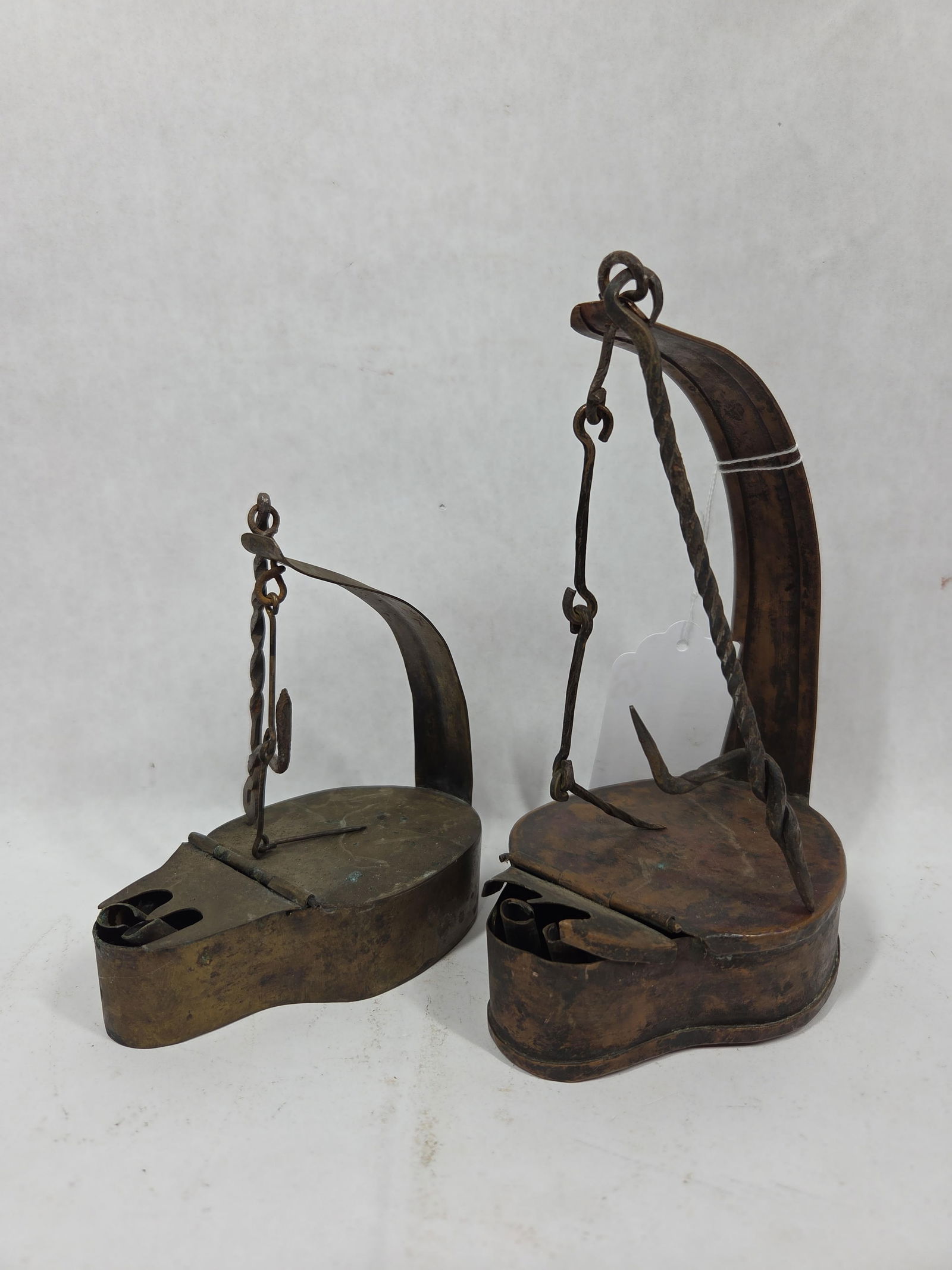 Hand Forged Joseph Stanem 18th C. Betty / Whale Oil Lamps: Great brass / bronzed finish with both being fully intact showing expected wear for age and usage measuring5.25 and 7 in H