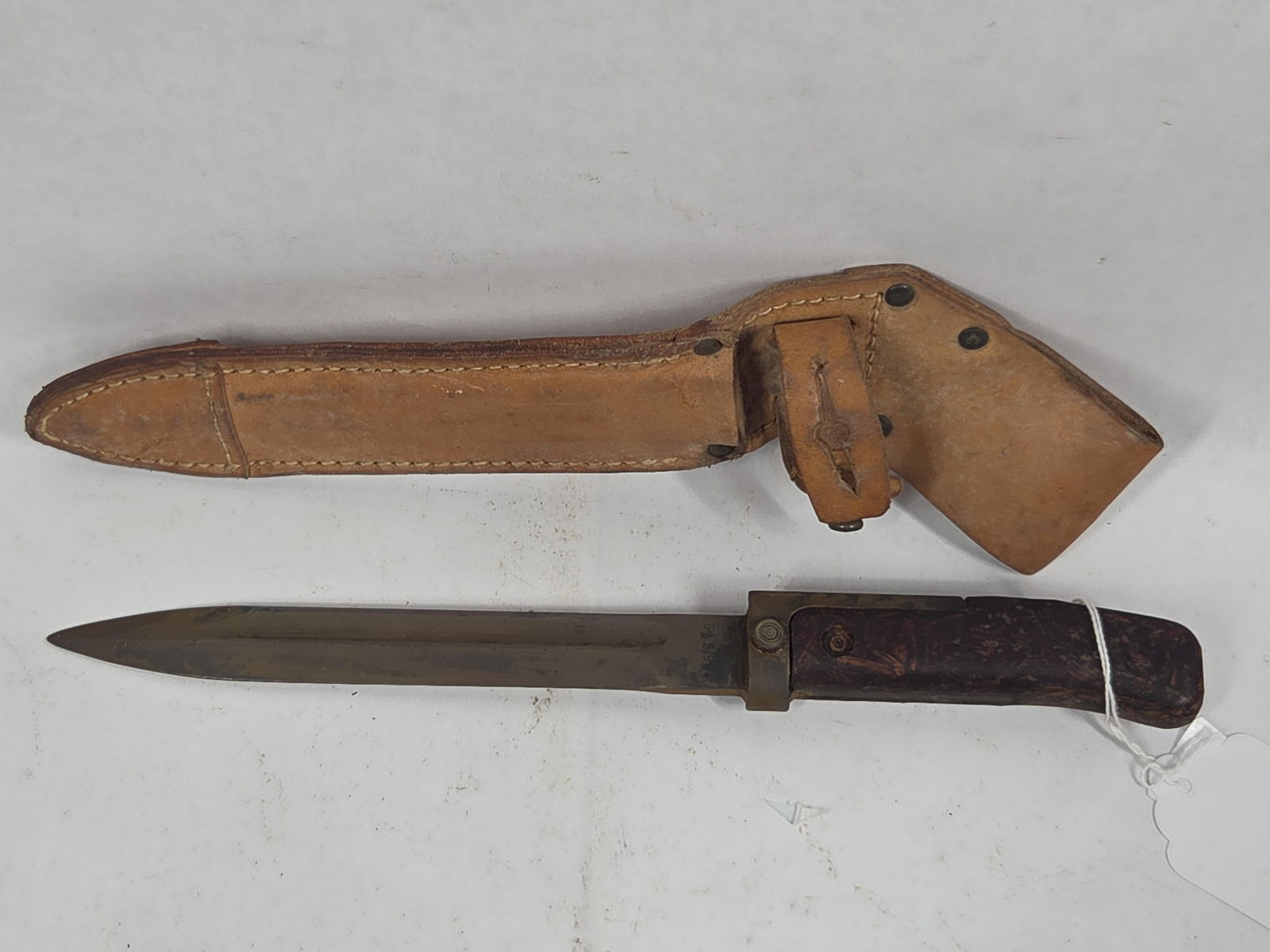 Original Military Bayonet w/ Leather Sheathe 02/O/6579: overall good condition showing wear due to age and usage with blade being 6 in. and overall being 11.5
