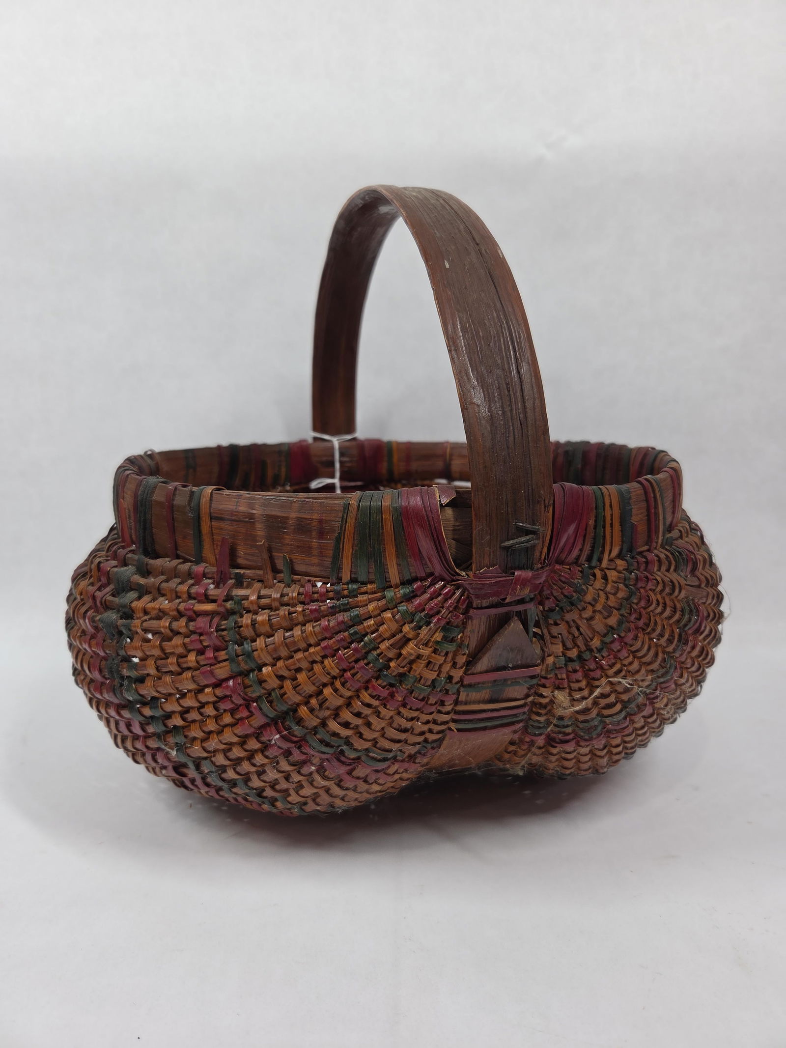 Great Early Hand Woven and Dyed Multi Color Buttock Style Handled Rib Basket: Great overall condition 12 in.