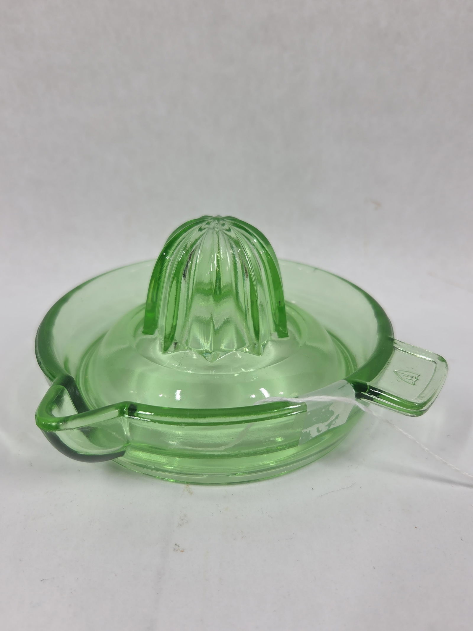 Federal Glass Co. Green Depression Uranium/Vaseline Glass Juicer: no chips, cracks or breaks and measures 6 in. D