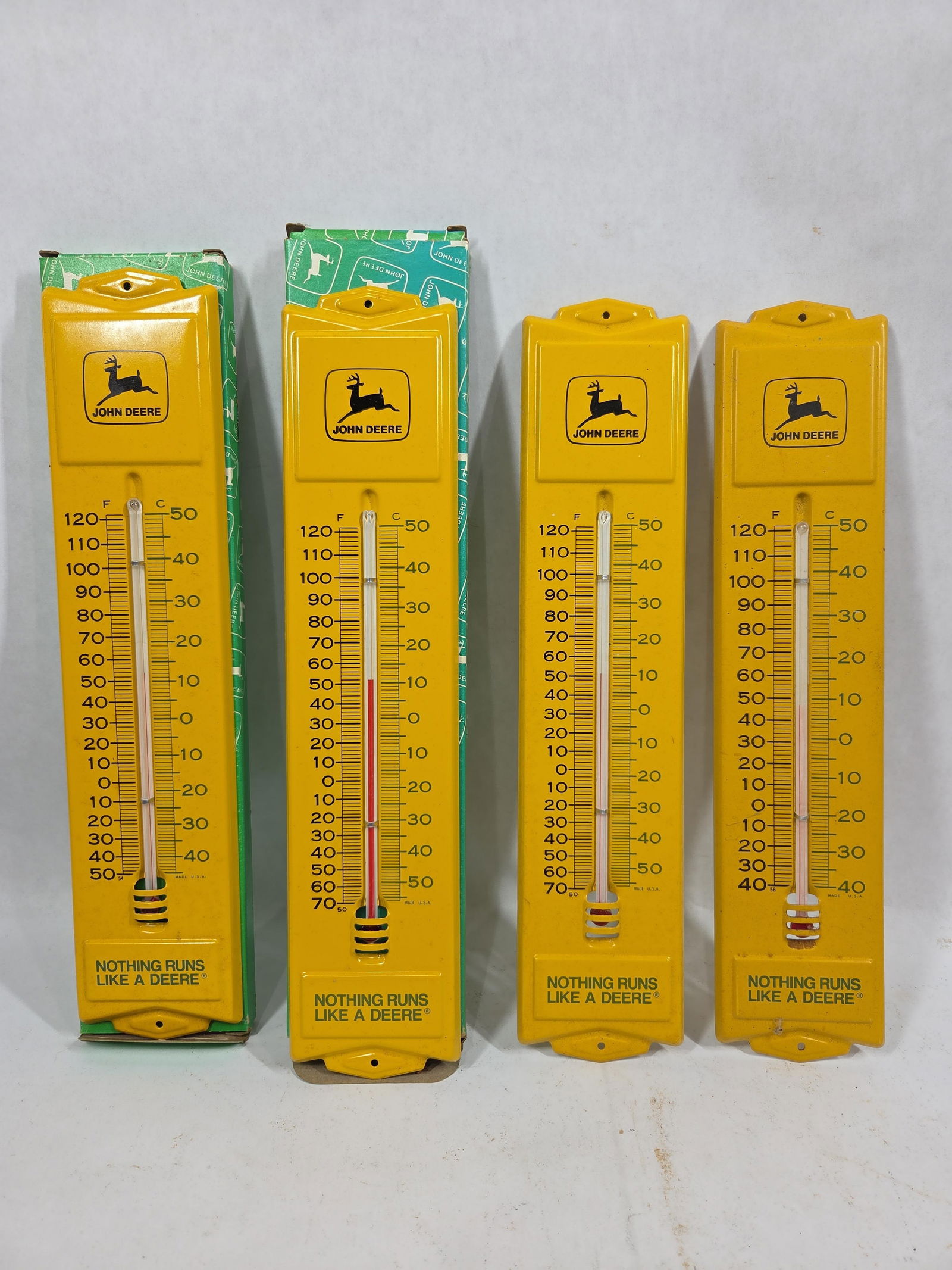NOS John Deere Advertising Thermometers: Two include boxes. 4 tin thermometers included, each is working. 12x3
