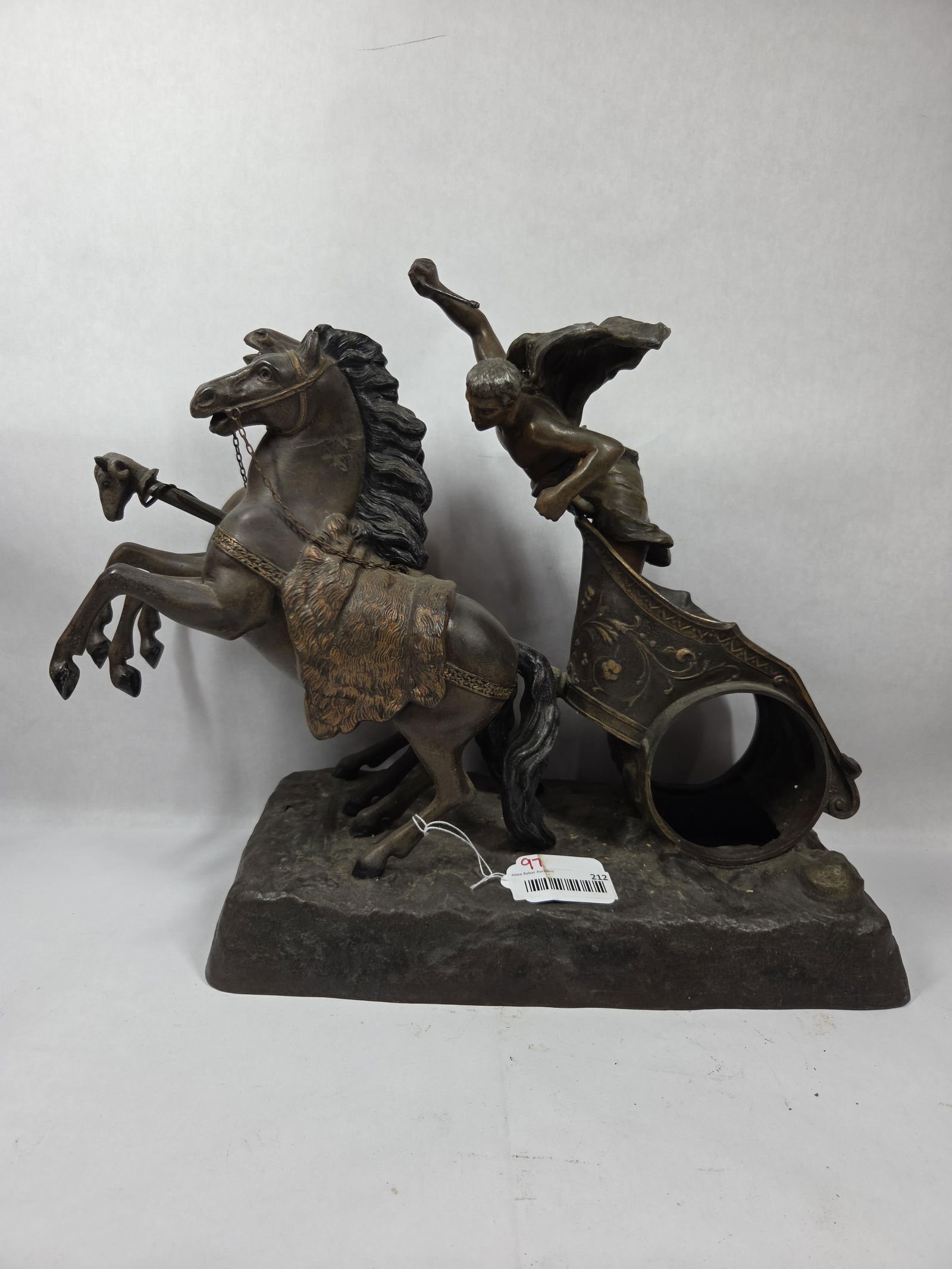 Roman Gladiator w/ Team & Chariot: This Spectacular piece features many details, including a goat head on chariot, floral decor to chariot and more. Missing the clock face and workings with a repair to the Gladiators midsection and