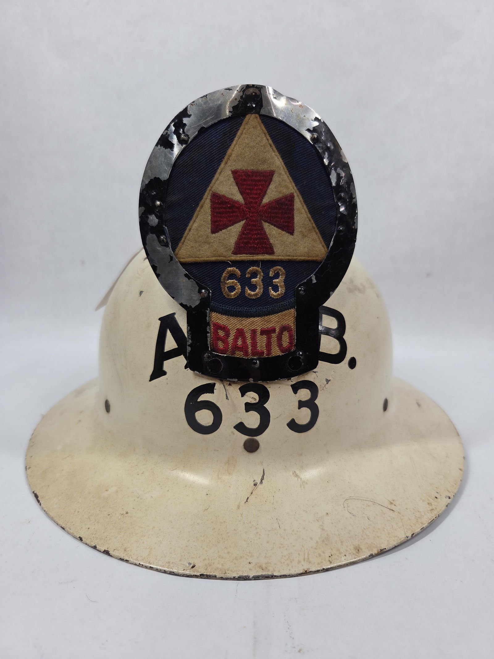 Civil Defense Firemens Helmet: Balto 633 badge to front as well as painted to helmet. Stamped to inside of helmet office of civil defense United States Government. Helmet liner is in good condition.