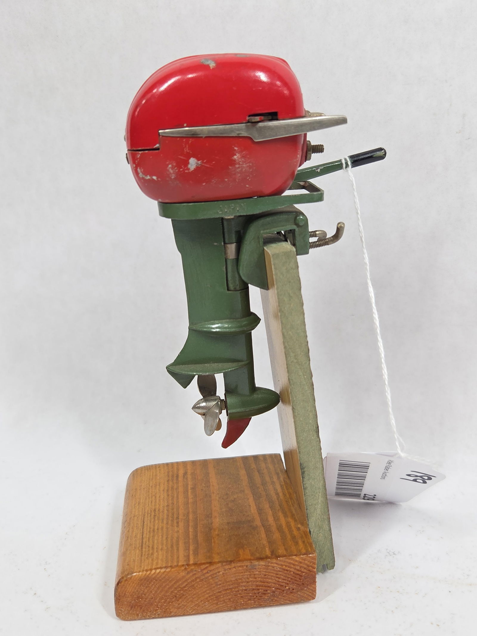 1950s Electric Outboard Motor: Japanese made, on wooden stand. A few minor paint chips. Not tested