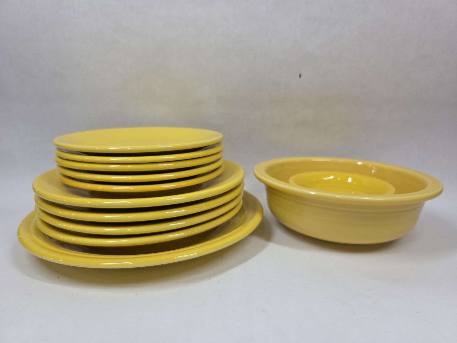Sunflower Yellow Fiesta Dinner and Dessert Plates, and Bowls: 12 pieces all in good condition.